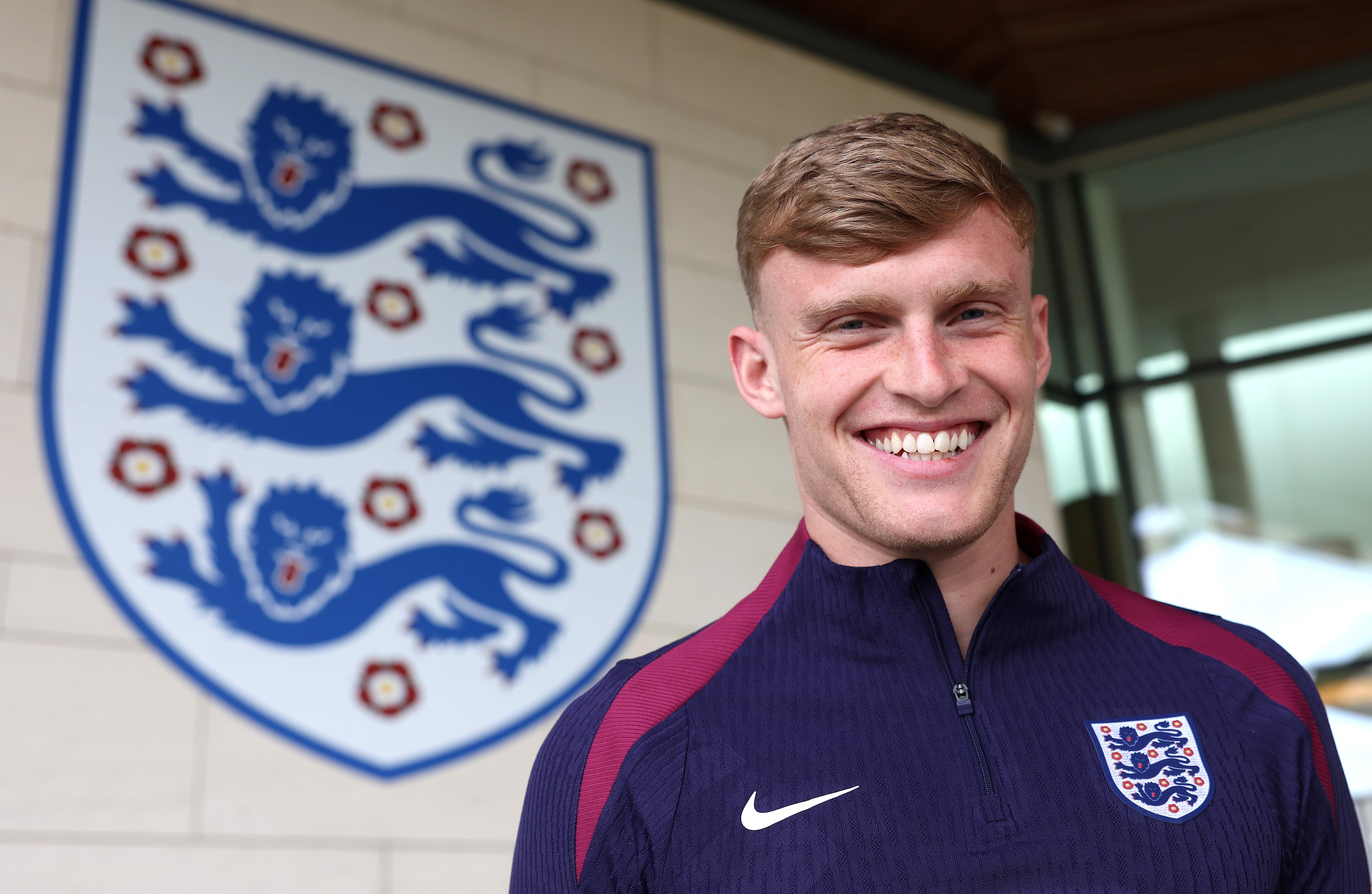 Jarrad Branthwaite poses beside the Three Lions at St George’s Park