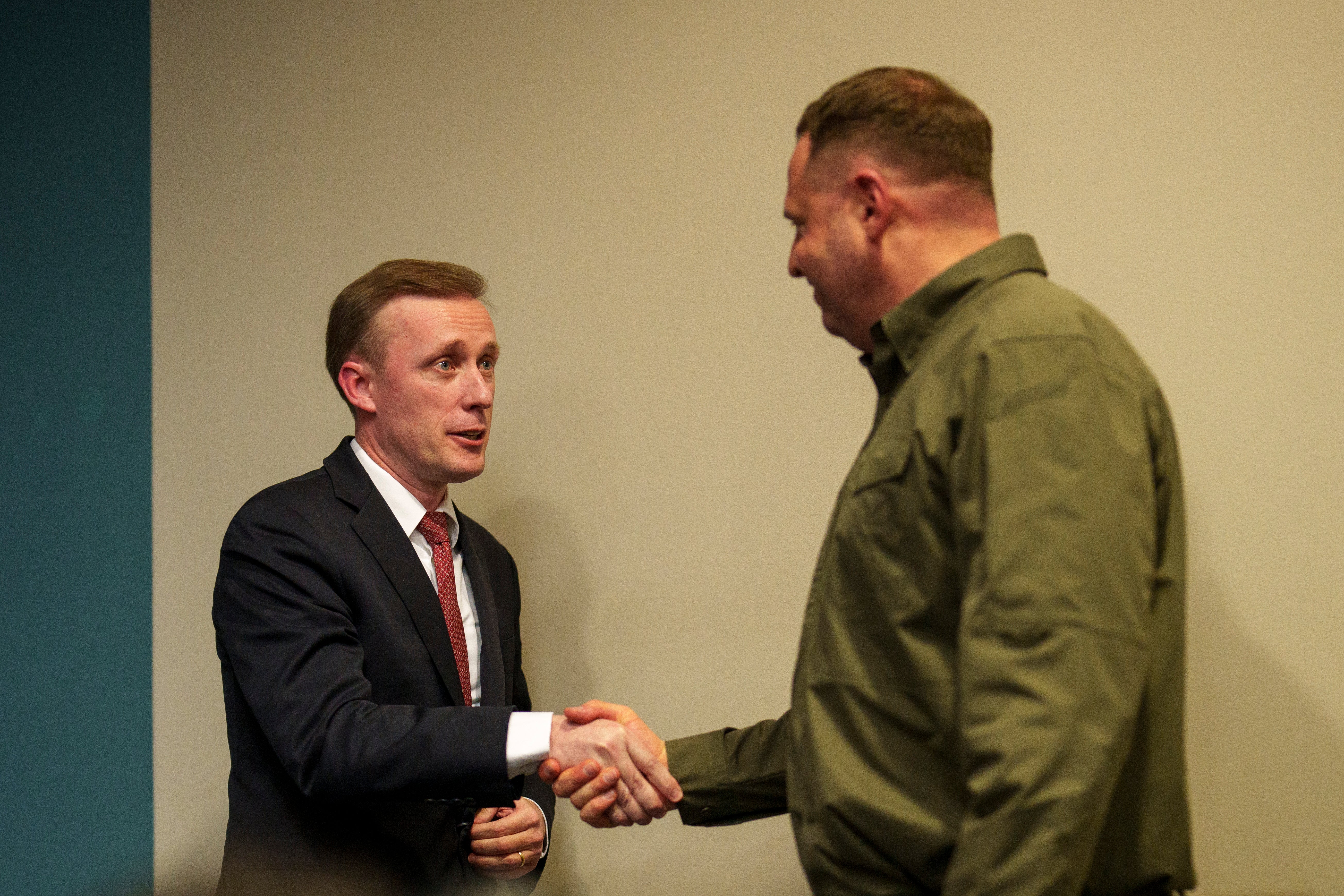 White House national security adviser Jake Sullivan, left, shakes hands with the Andriy Yermak