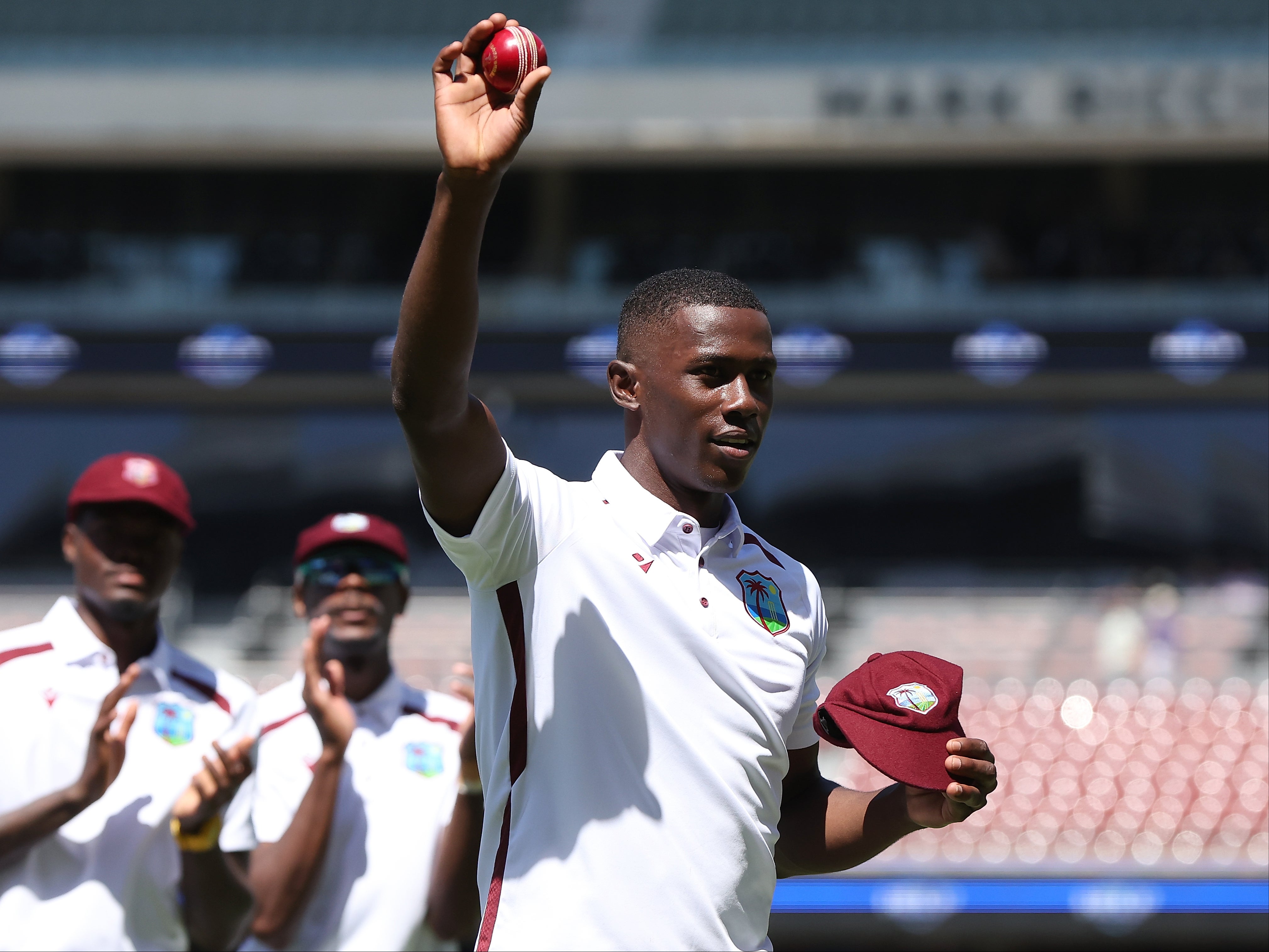 Joseph holds the ball aloft in Adelaide after taking five wickets against Australia