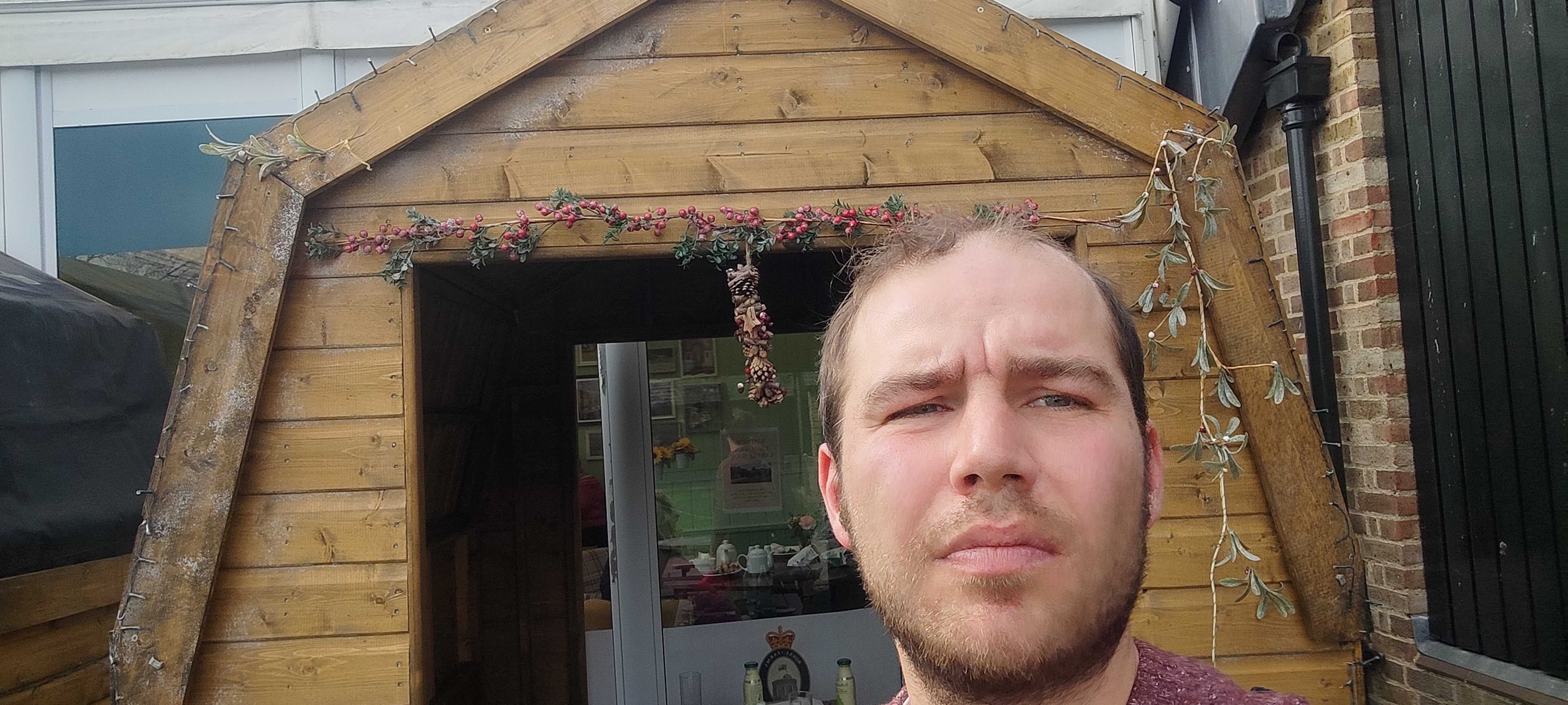 Unprofessional Prince William lookalike Barney Davis checks the Christmas decorations are still up at Windsor Farm Shop