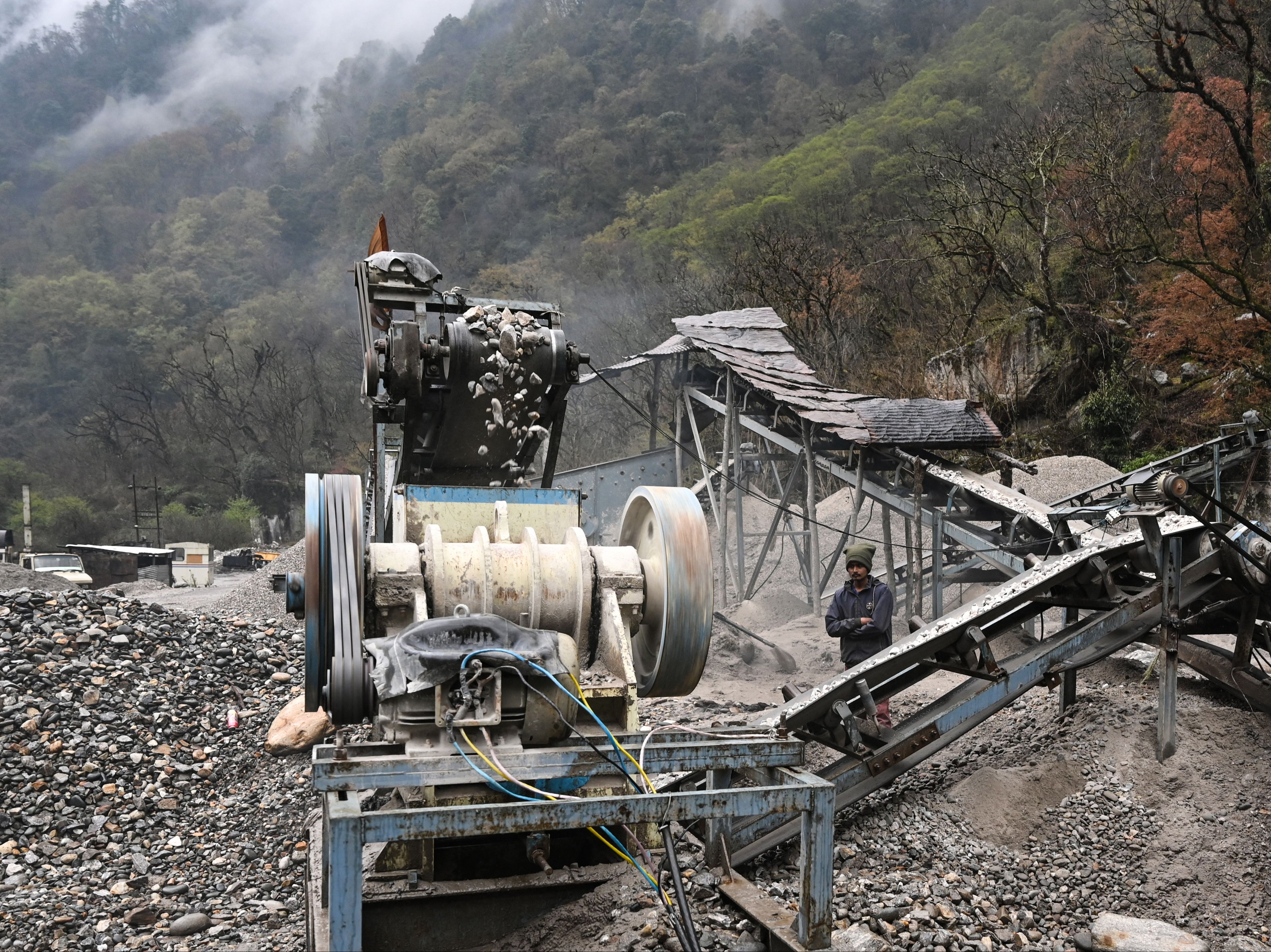 This picture taken on 4 April 2023 shows a road construction site in the Tawang district of India’s Arunachal Pradesh state. - Freshly laid roads, bridges, upgraded military camps, and new civilian infrastructure dot the winding high Himalayan route to the Indian frontier village of Zemithang -- which China renamed last month to press its claim to the area. It is in the far northeastern Indian state of Arunachal Pradesh, almost all of which Beijing insists falls under its sovereignty as 'South Tibet’