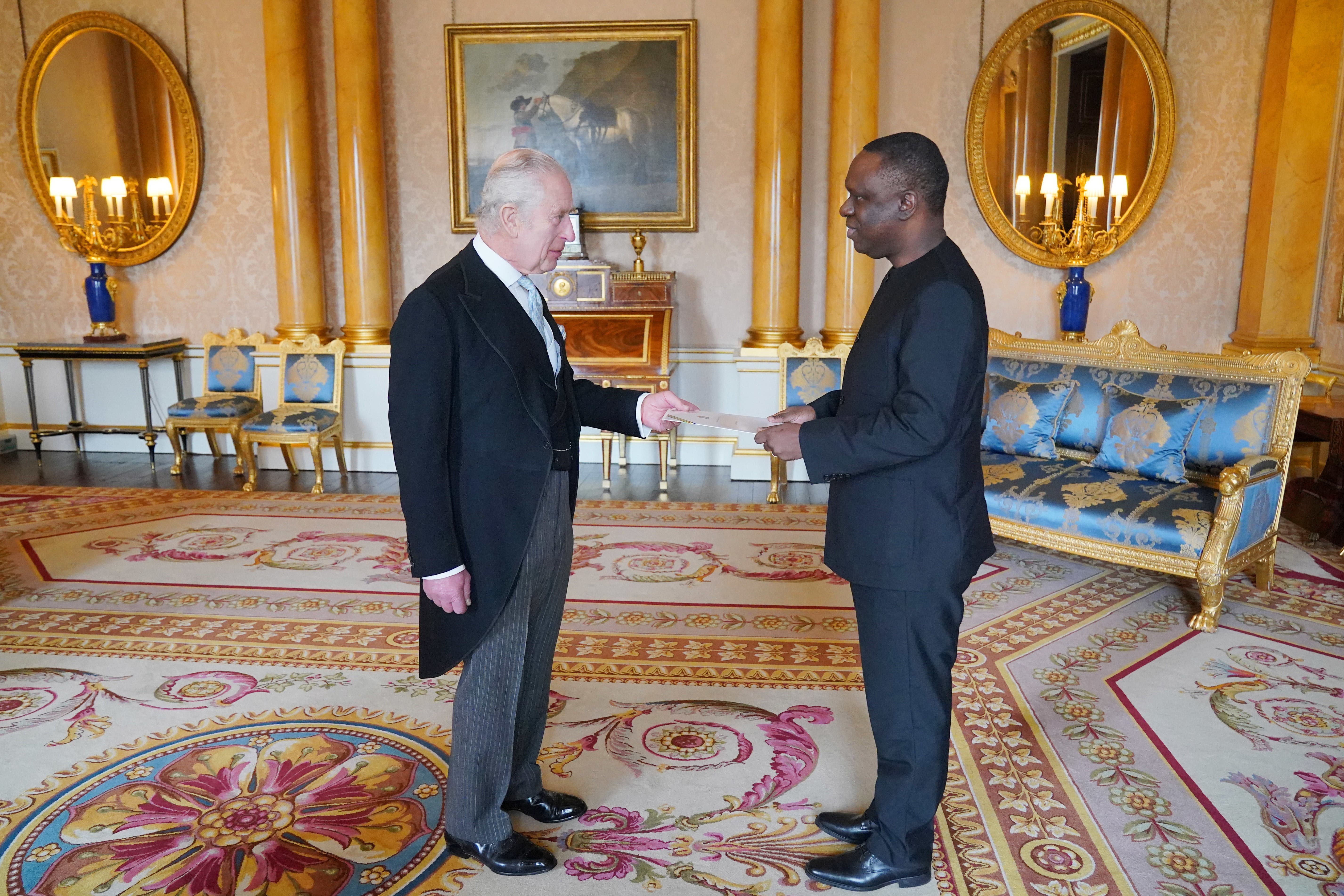 Tanzanian High Commissioner Mbelwa Kairuki presents his credentials to the King during a private audience at Buckingham Palace (Jonathan Brady/PA)