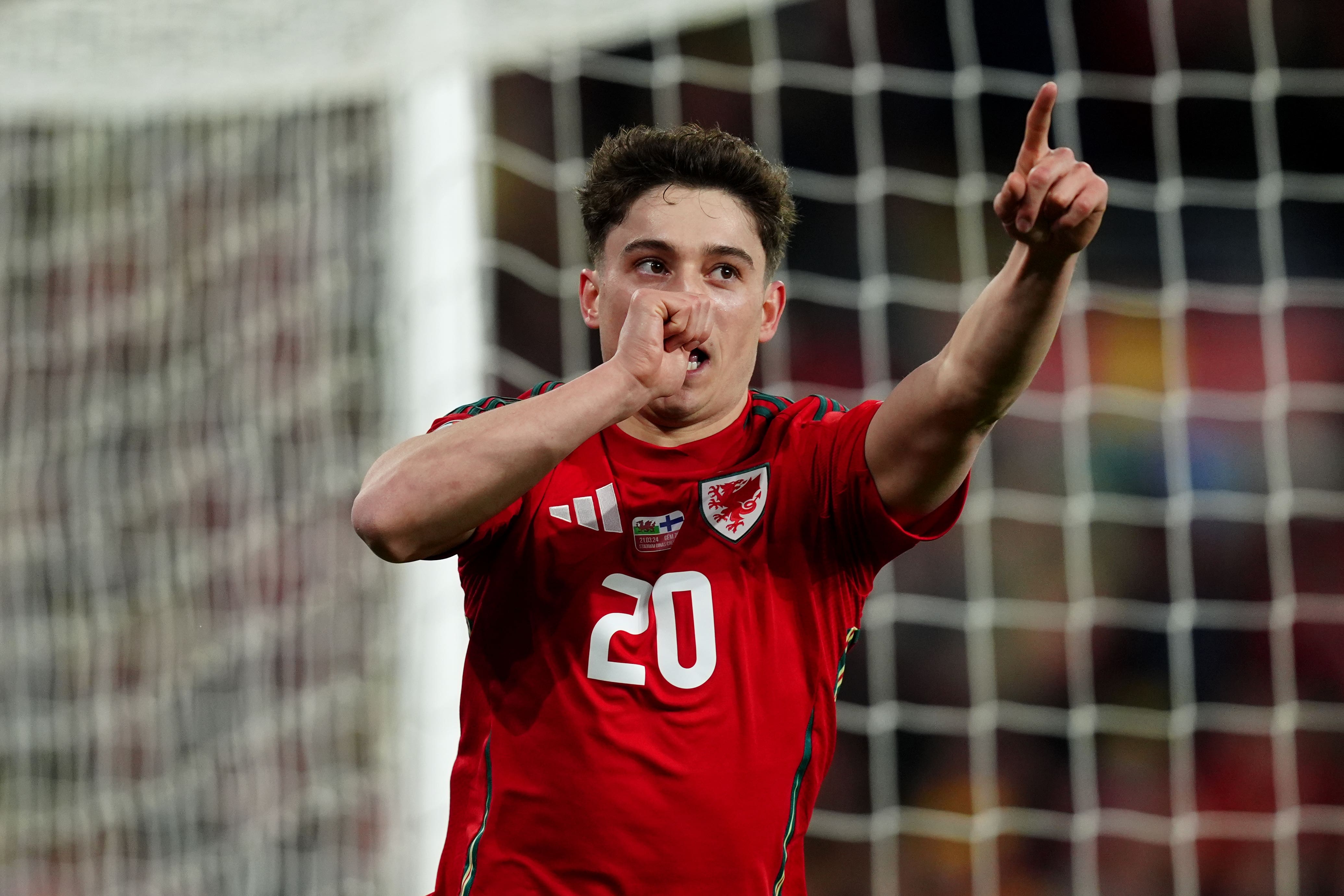 Daniel James celebrates after scoring Wales’ fourth goal in their Euro 2024 play-off semi-final victory over Finland (David Davies/PA)