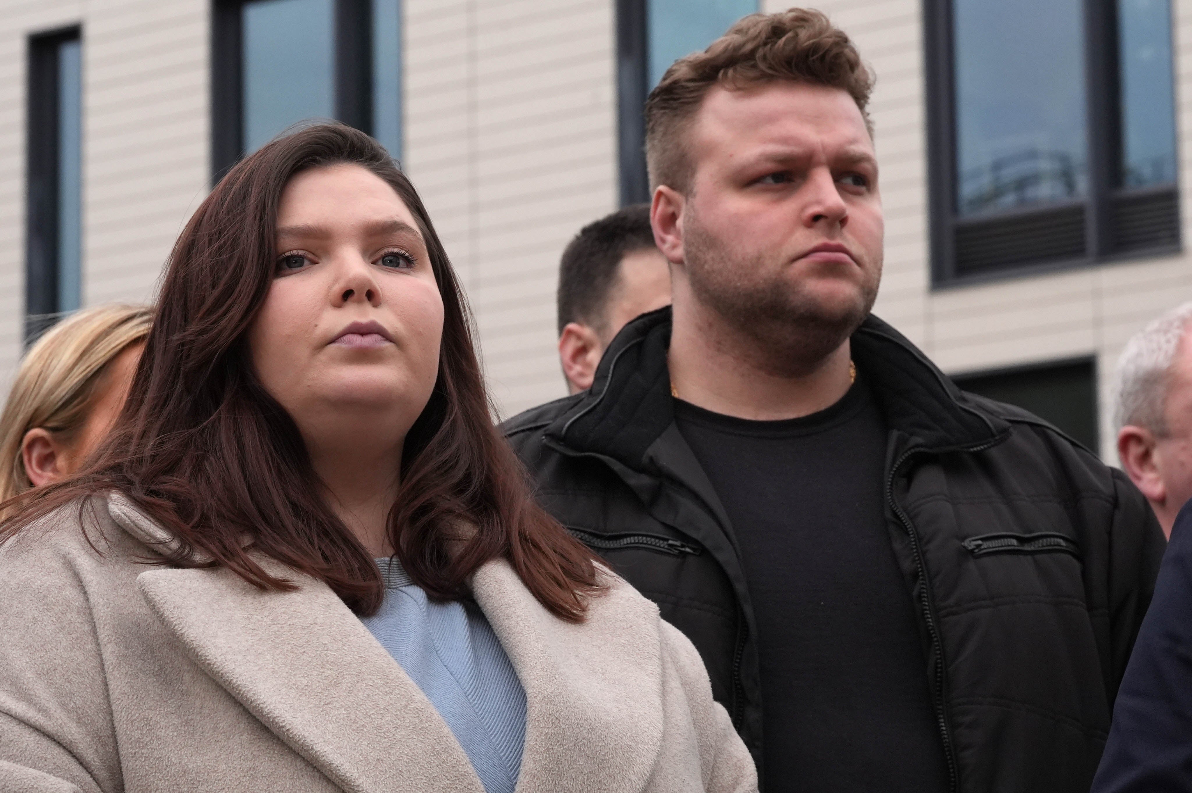 Ellie and Harry Baxter, the son and daughter of Stephen, 61, and Carol, 64, Baxter, outside Chelmsford Crown Court after D’Wit was jailed for life