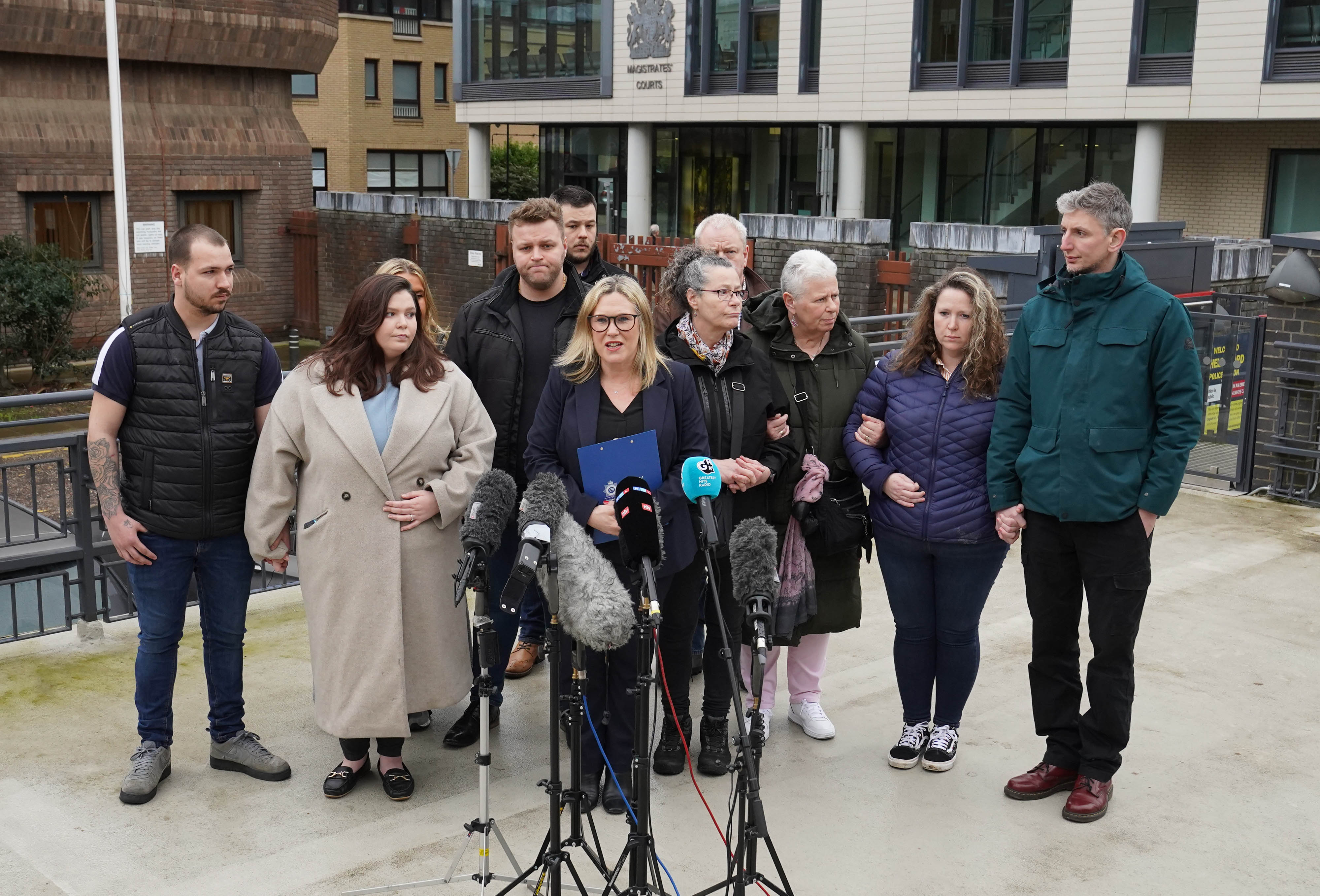 The family of Stephen and Carol Baxter speaking to the media outside court