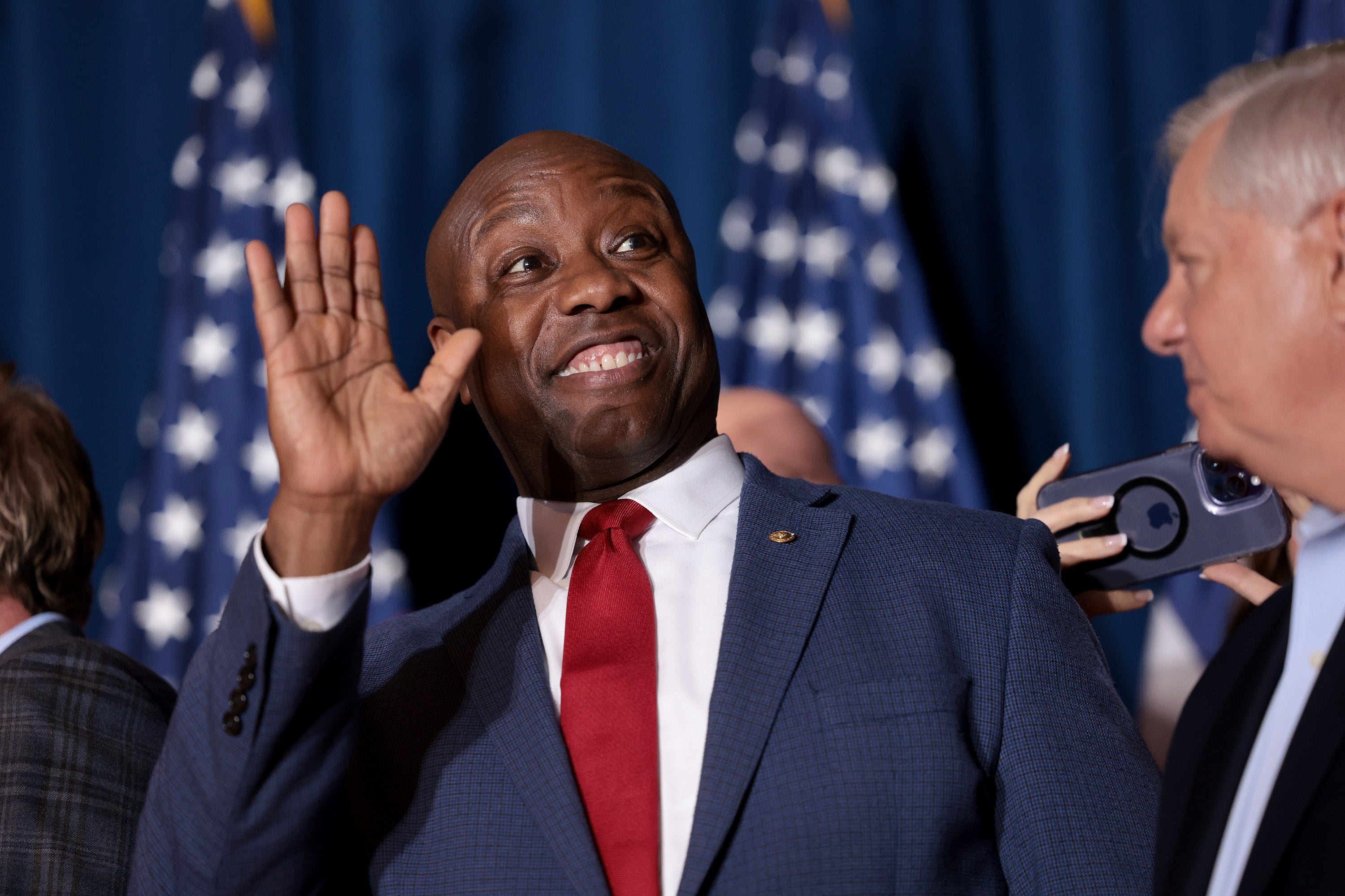 Tim Scott cheers on Donald Trump as he speaks during an election night watch party in Columbia, South Carolina