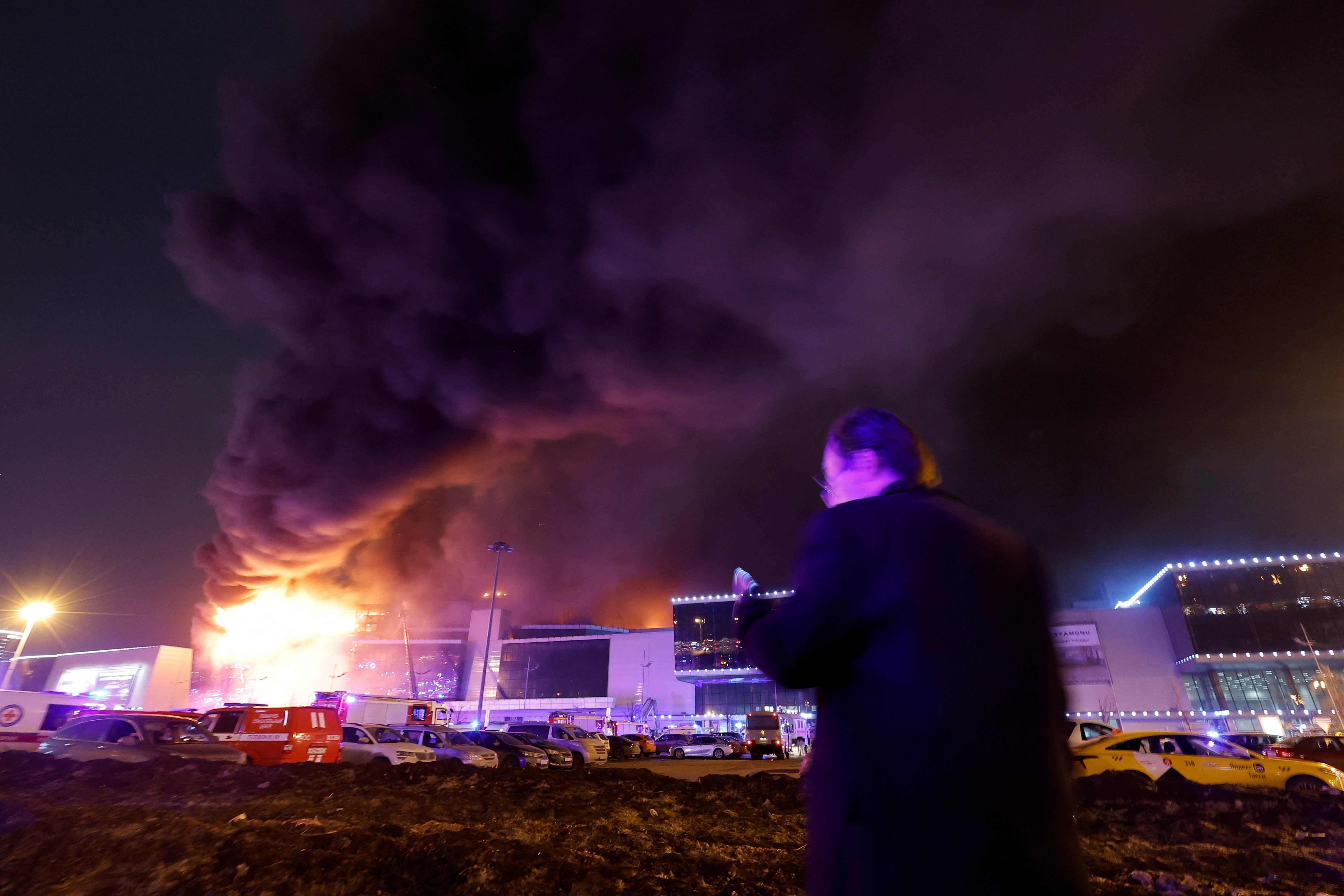 Smoke rises from the building as emergency services try to contain the blaze