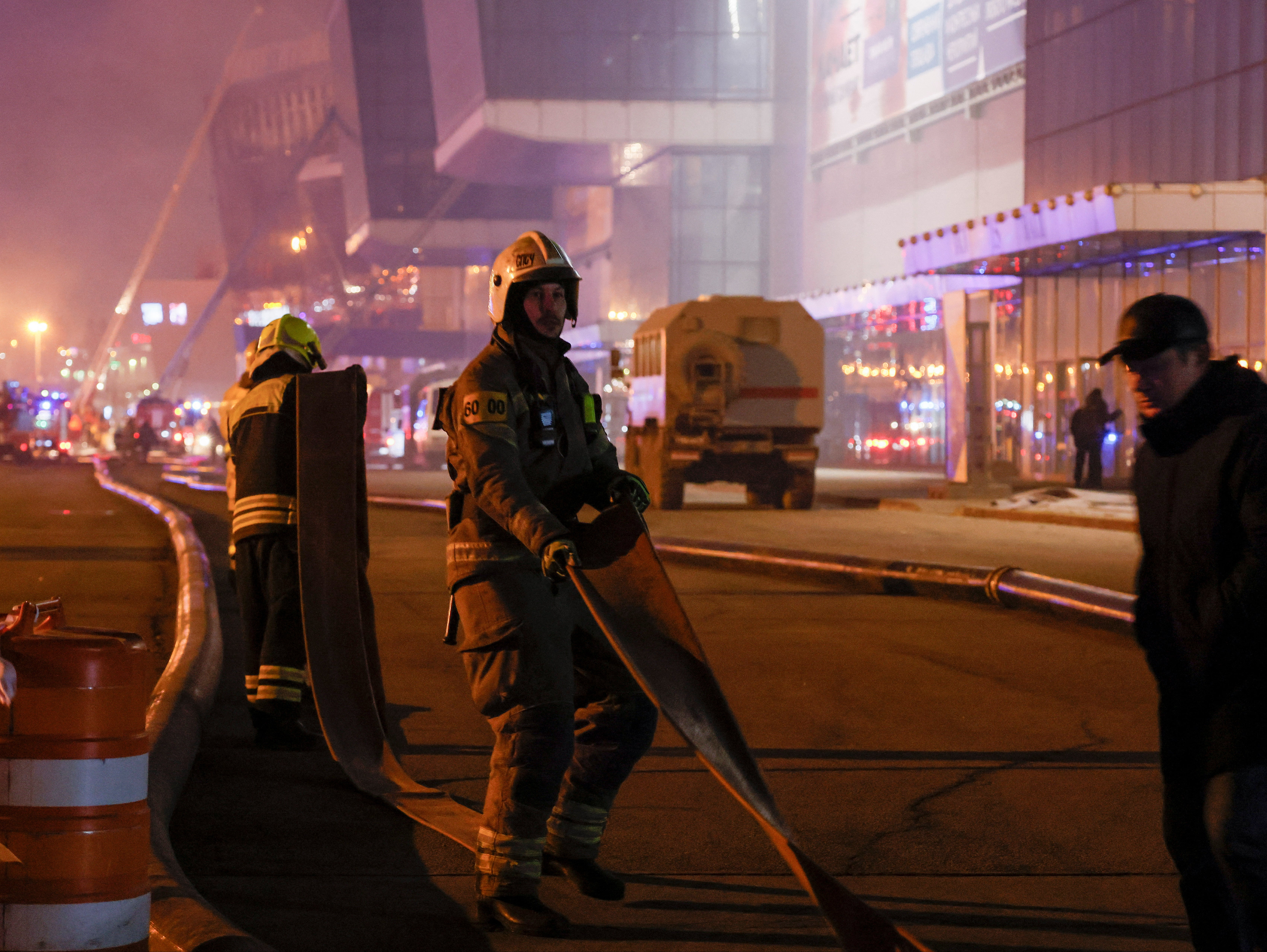 Firefighters work near the burning Crocus City Hall concert venue following a shooting incident, outside Moscow, Russia, 23 March 2024. REUTERS/Maxim Shemetov
