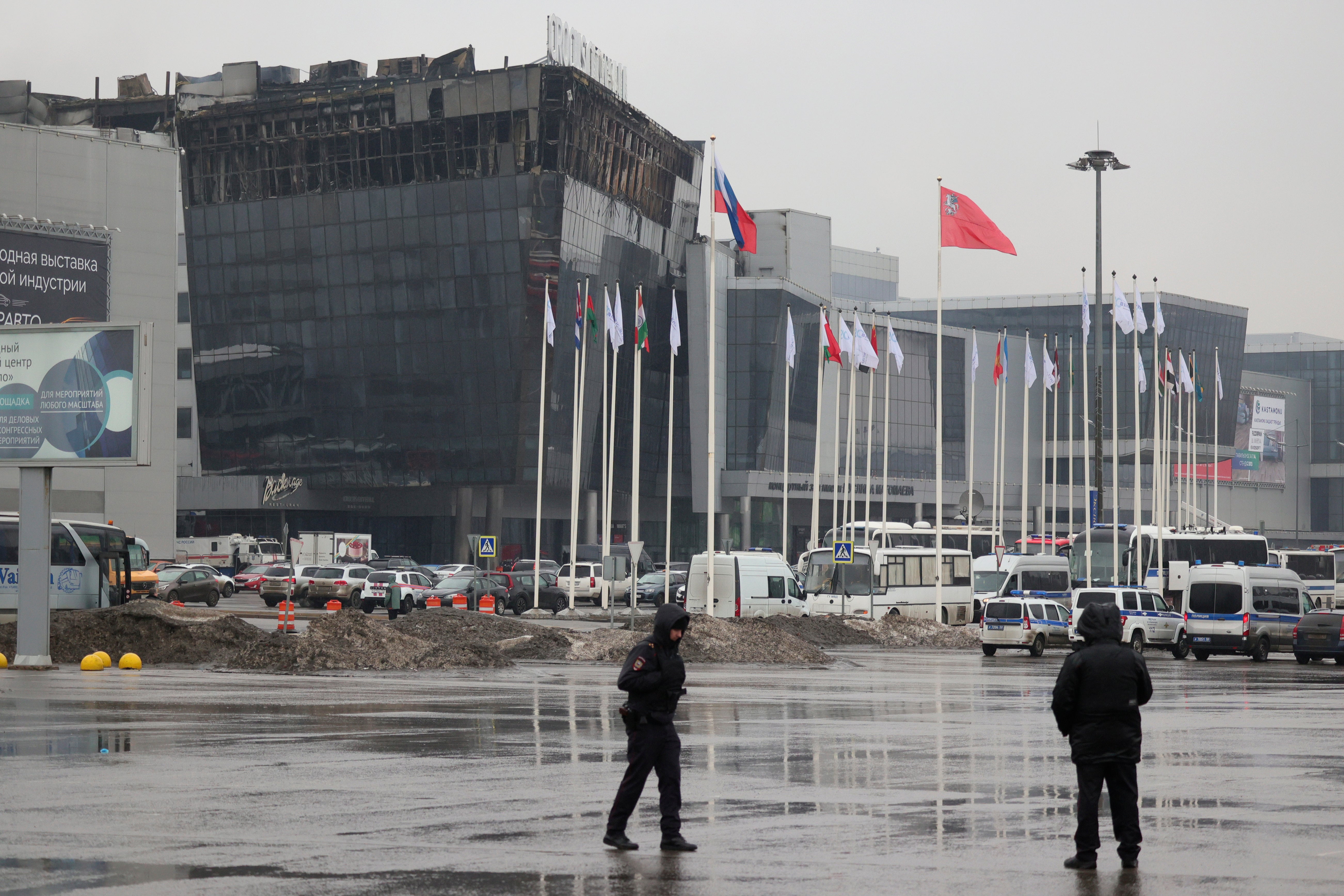 Police officers secure an area near the Crocus City Hall on the western edge of Moscow, Russia