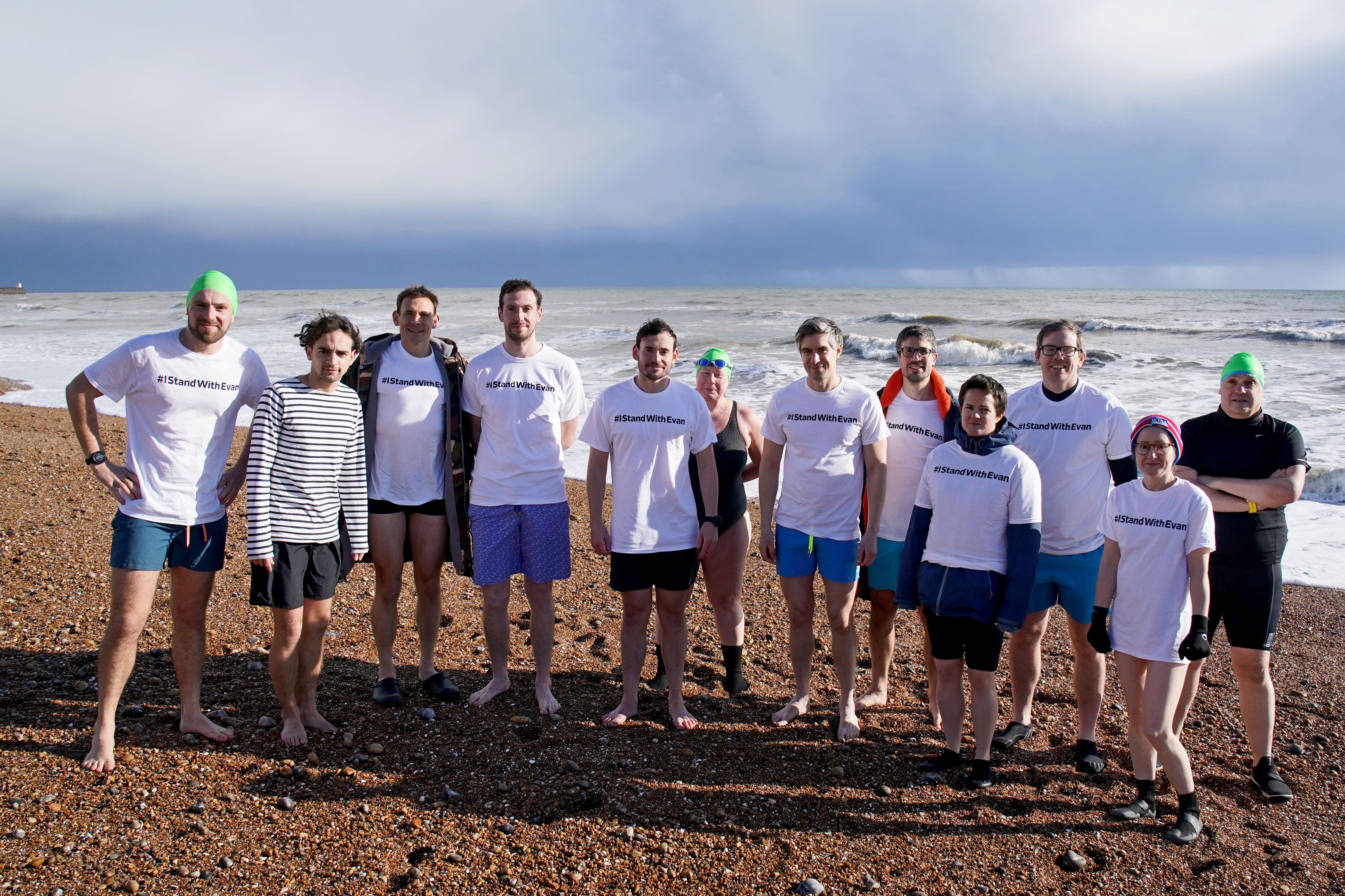 Journalists and swimmers set off from Brighton beach (Gareth Fuller/PA)