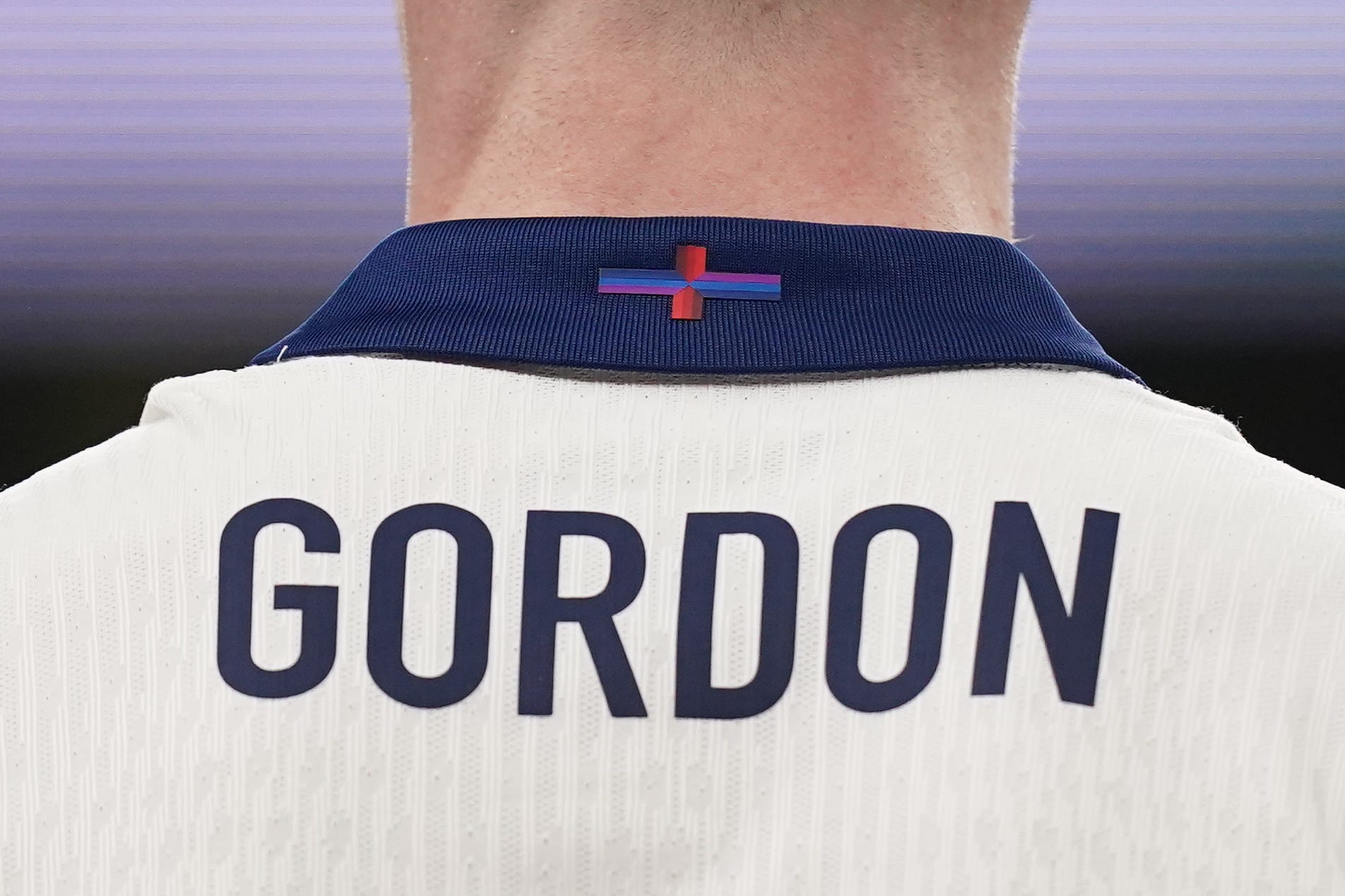 The St George’s Cross detail on the back of the shirt of England’s Anthony Gordon (PA)