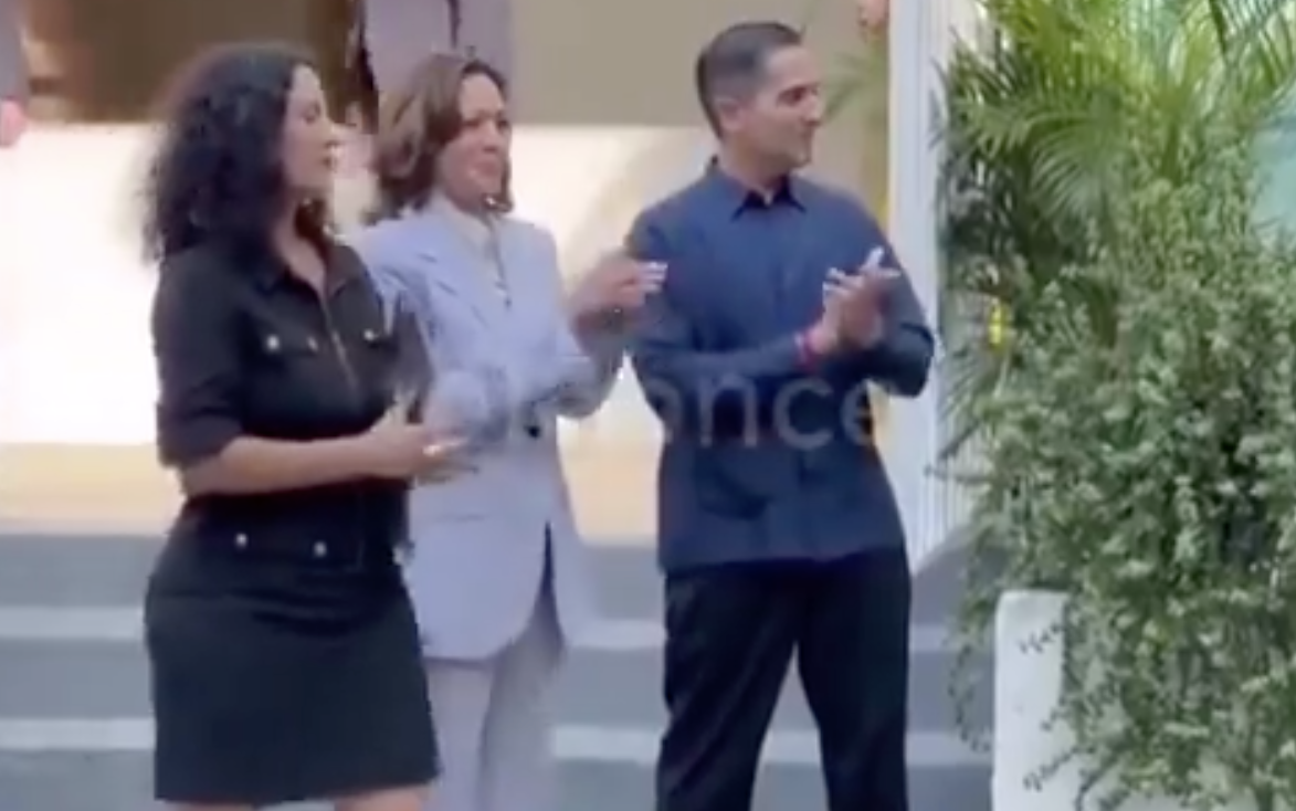 Kamala Harris was seen gleefully clapping and smiling as Puerto Rican protesters sang