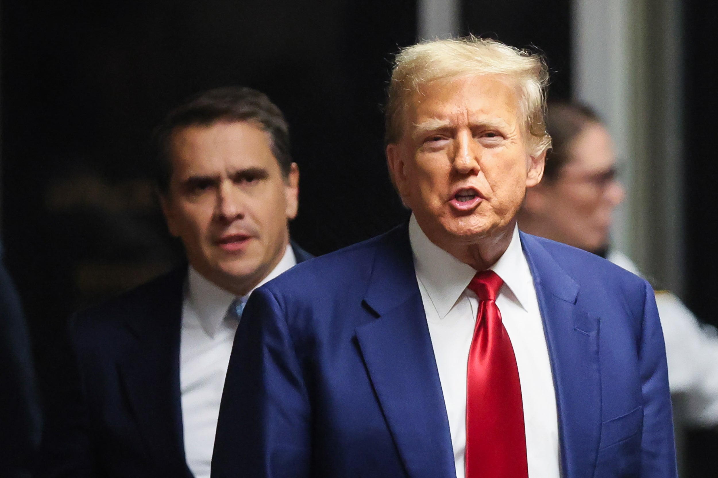 Donald Trump appears with his attorney Todd Blanche outside a Manhattan criminal courtroom on 25 March.