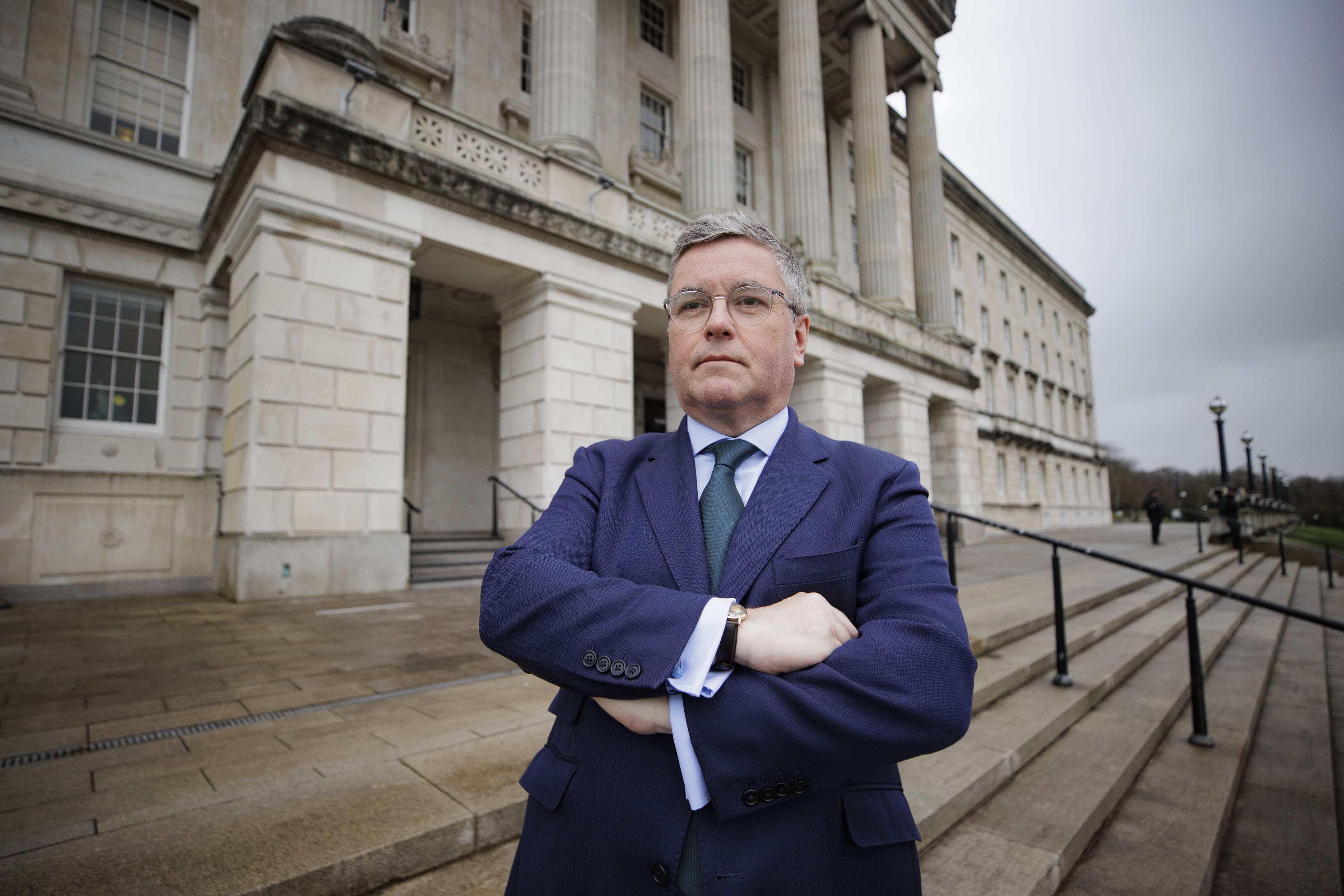 Sir Robert Buckland, chair of the Northern Ireland Affairs Committee, poses for a photograph at Stormont after a committee meeting (Liam McBurney/PA)