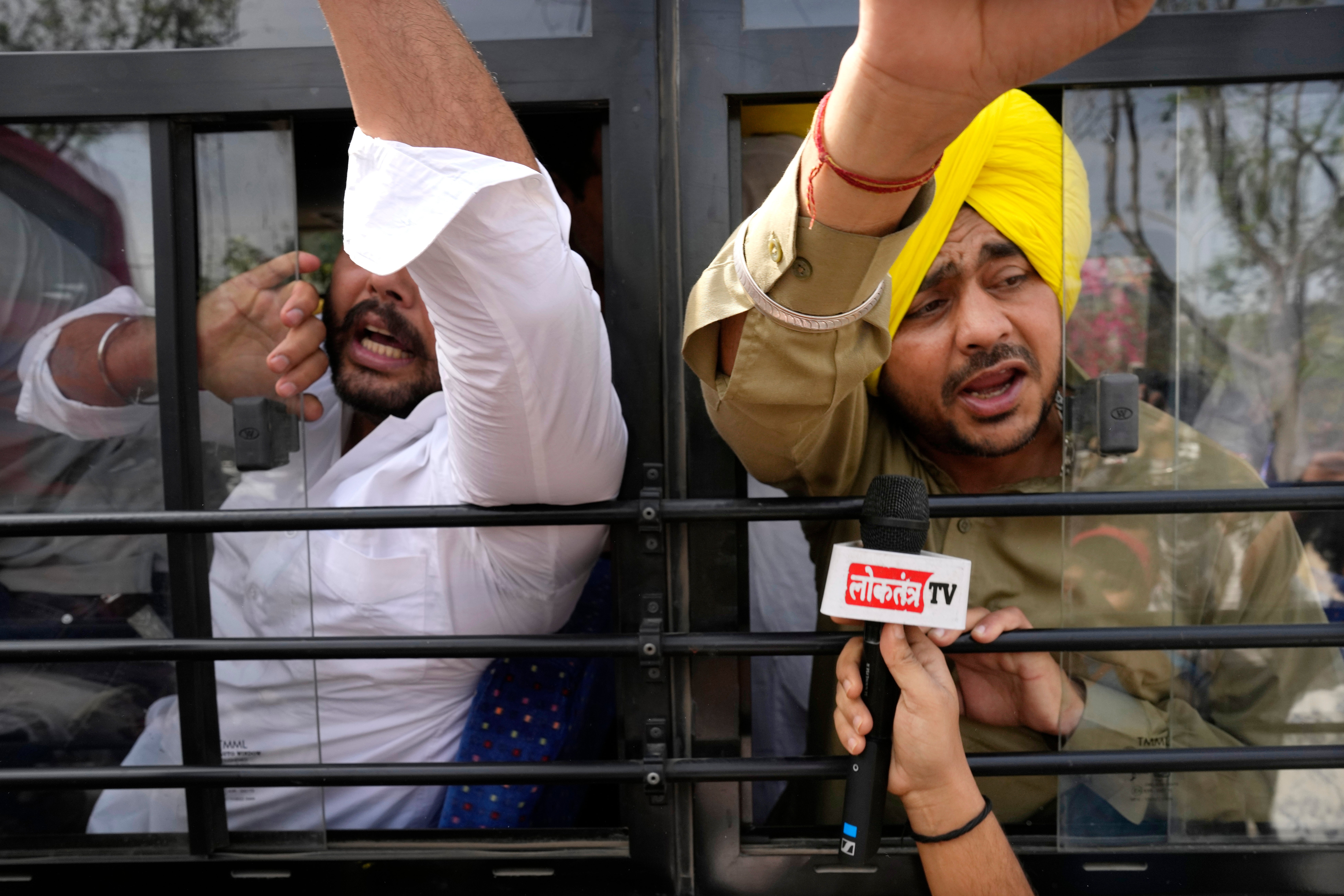 Members of Aam Admi Party, or Common Man’s Party, shout slogans as they are detained by police during a protest against the arrest of their party leader Arvind Kejriwal in New Delhi, India, Tuesday, 26 March 2024.