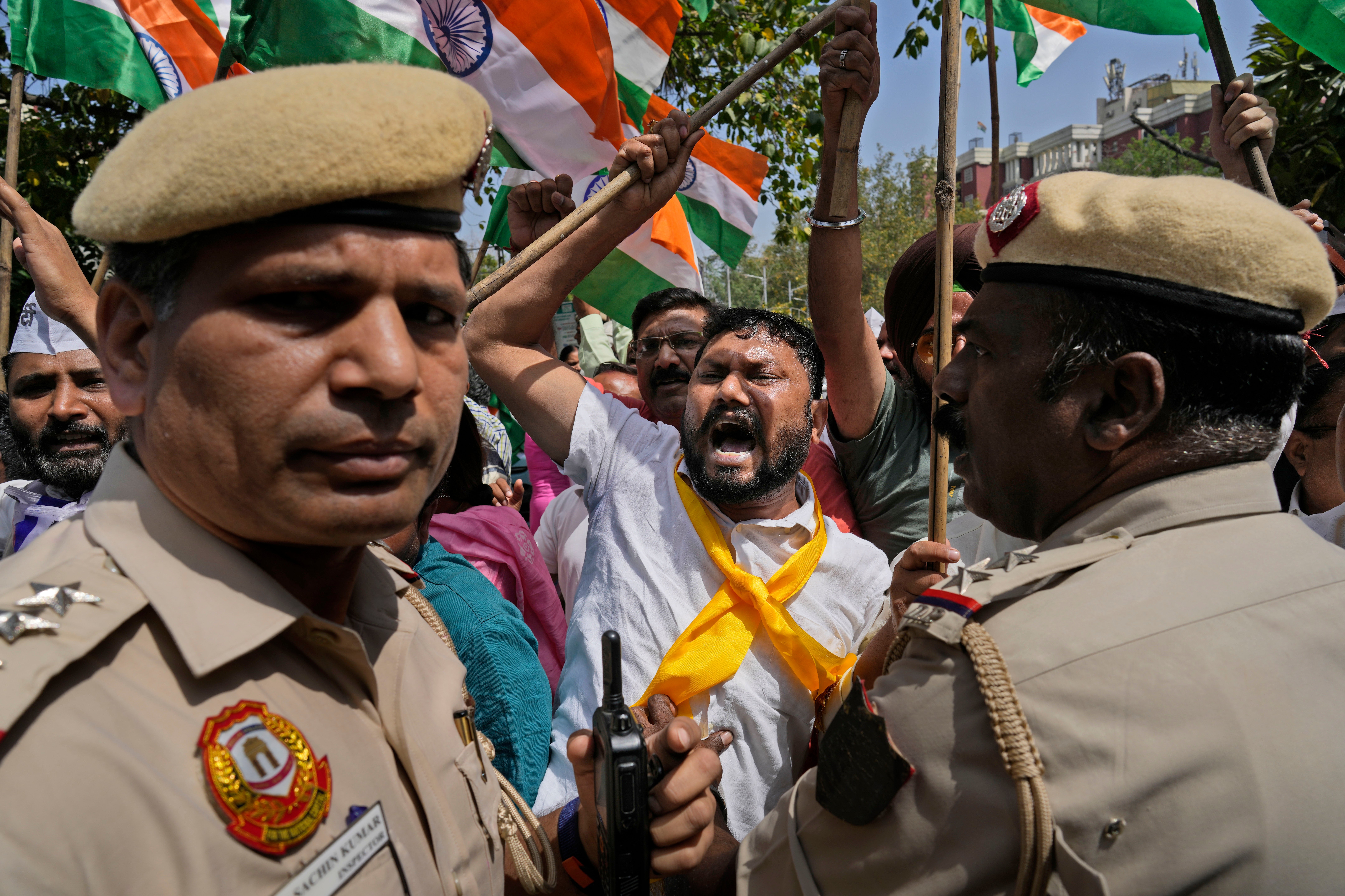 Members of Aam Admi Party, or Common Man's Party, shout slogans during a protest against the arrest of their party leader Arvind Kejriwal in New Delhi, India, Tuesday, 26 March 2024.