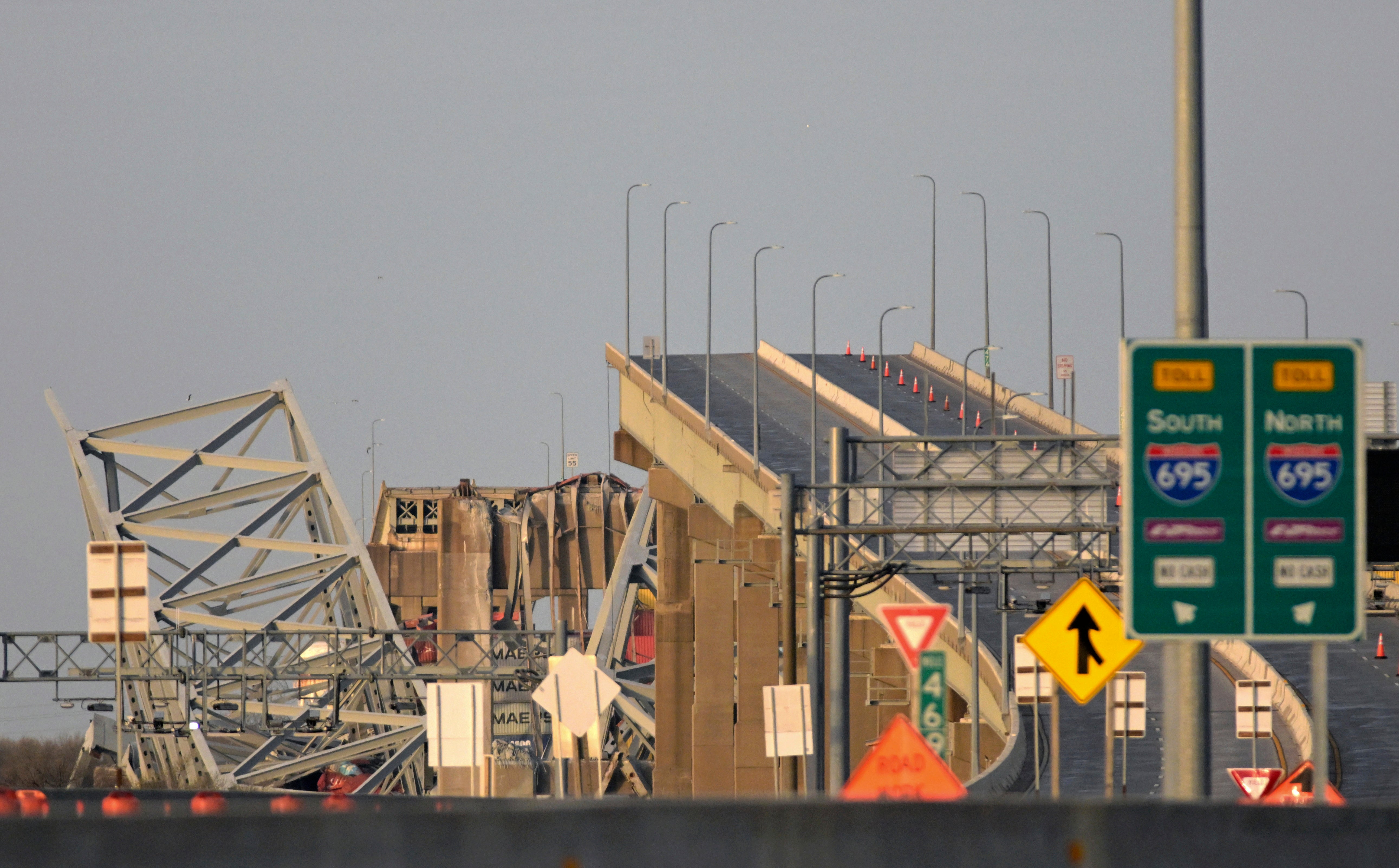 Parts of the Francis Scott Key Bridge remain after the collision