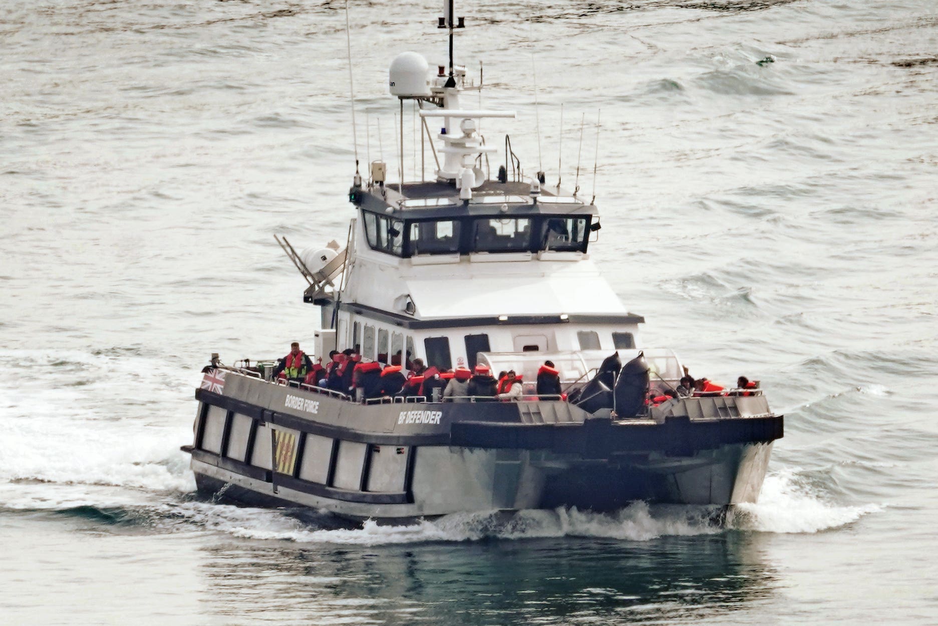 A group of people thought to be migrants are brought into Dover, Kent, onboard a Border Force vessel following a small boat incident in the Channel (Gareth Fuller/PA)