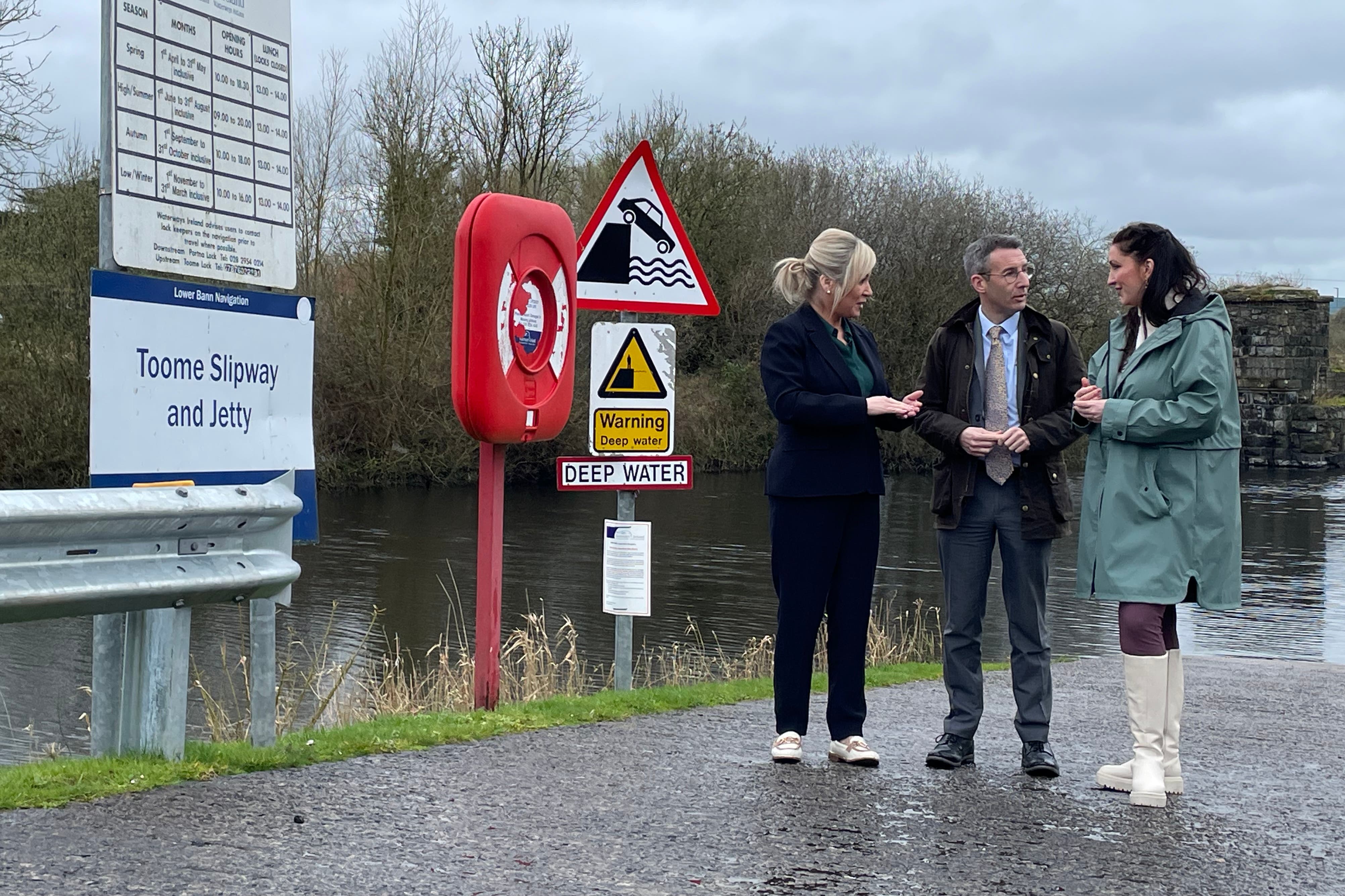 First Minister Michelle O’Neill, Agriculture, Environment and Rural Affairs Minister Andrew Muir and deputy First Minister Emma Little-Pengelly on the shores of Lough Neagh during a visit to the Lock Keepers Cottage in Toome (Rebecca Black/PA)