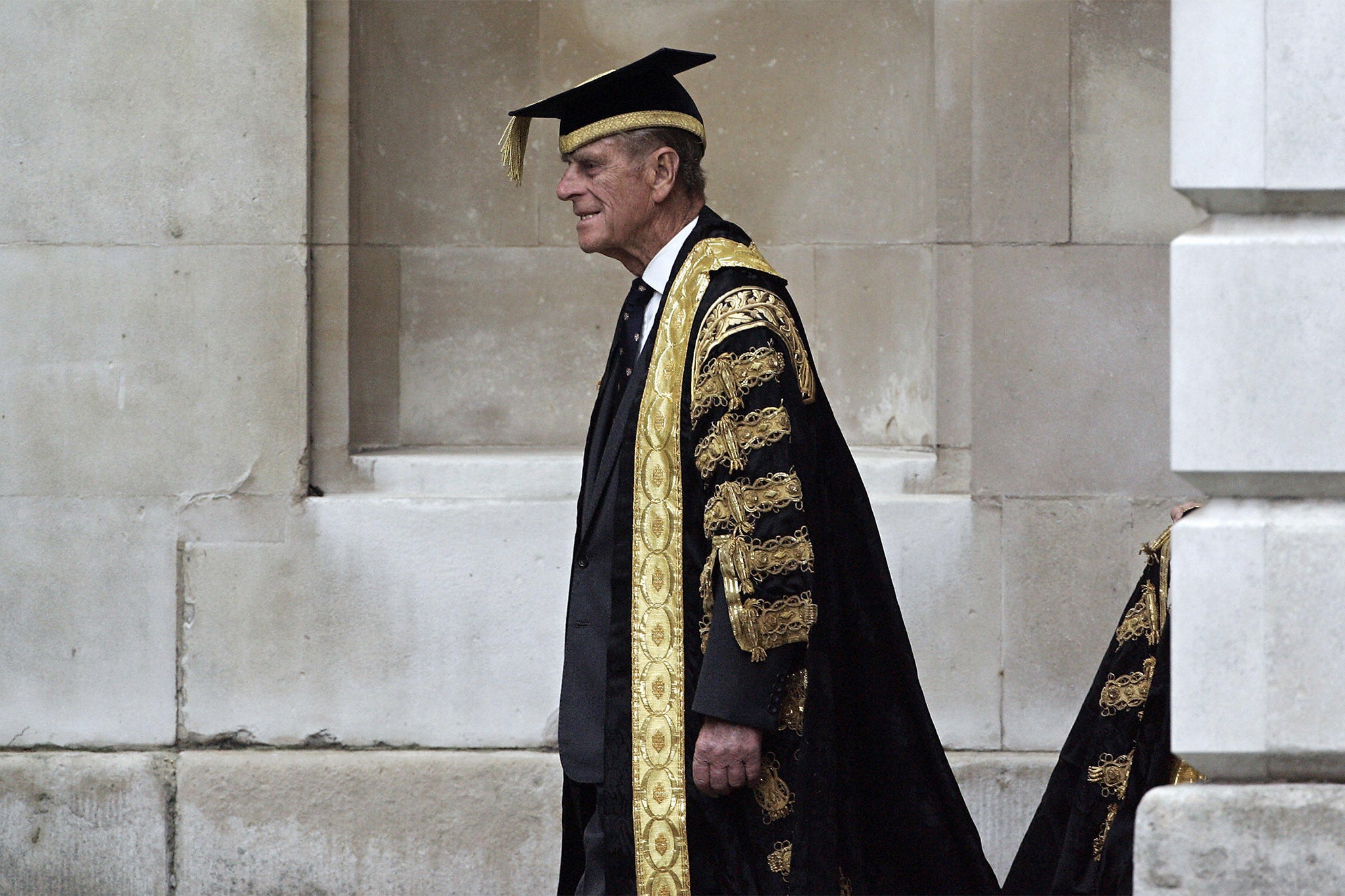 Britain's Prince Phillip leads a procession to the Senate House at Cambridge University in Cambidgeshire