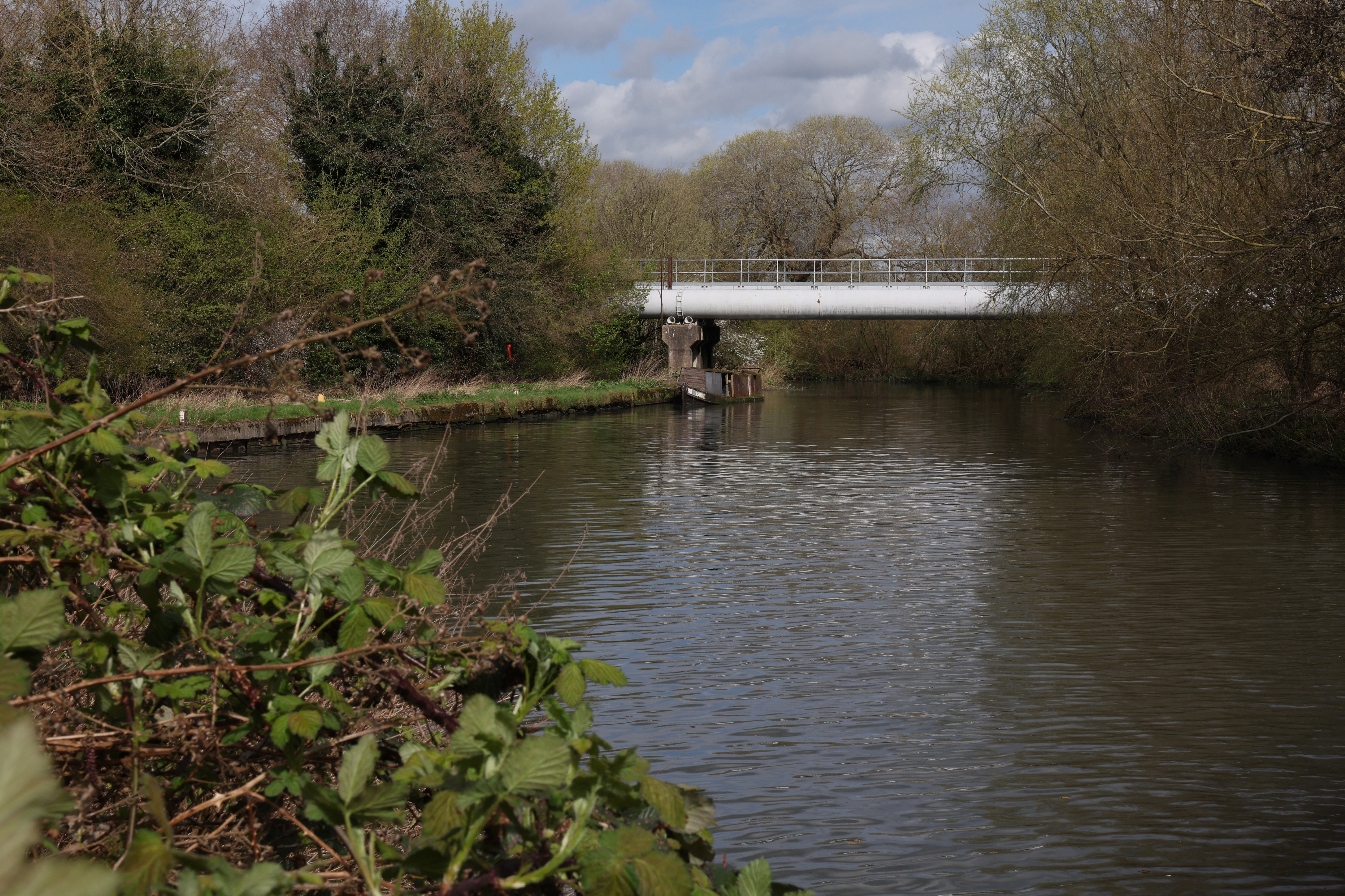 A sewage pipeline connected to Thames Water's Maple Lodge Sewage Treatment Works is seen over the River Colne near Maple Cross