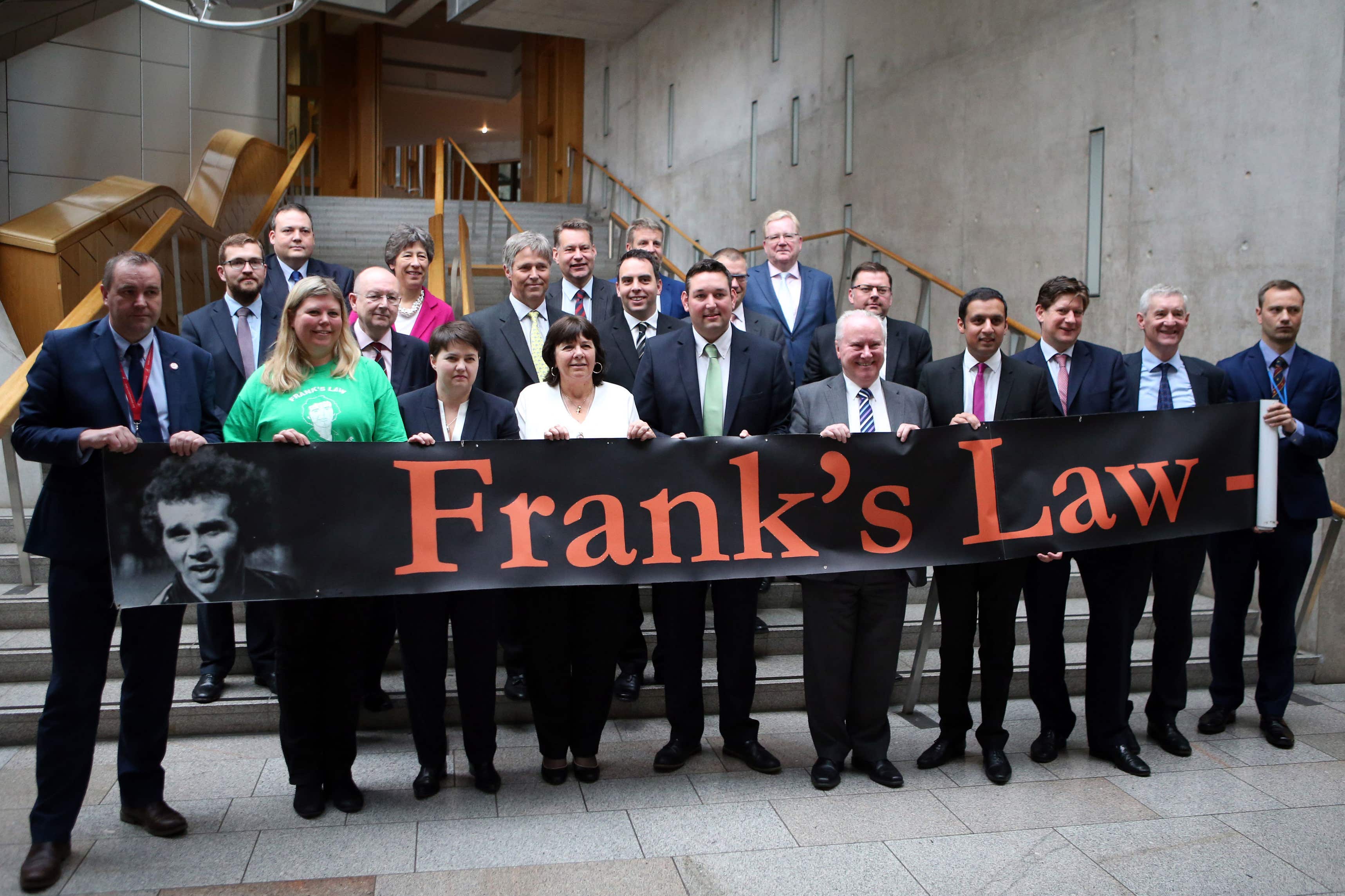 MSPs join Amanda Kopel (front, fourth left), whose husband Frank died having been diagnosed with dementia at the age of 59 (Jane Barlow/PA Wire)