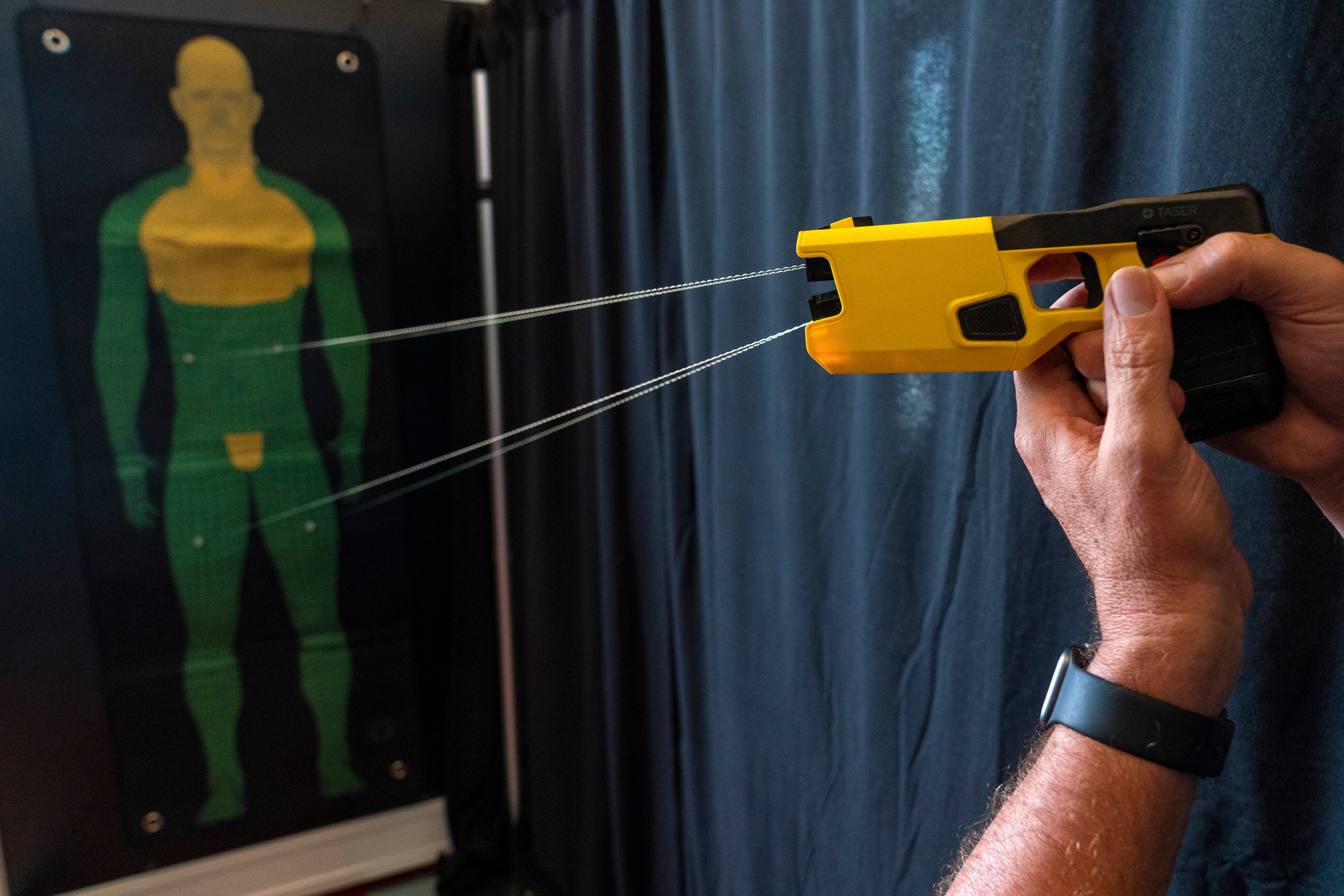 A representative for Axon Enterprise Inc. demonstrates the company's TASER 7 in Washington on Thursday, May 12, 2022.