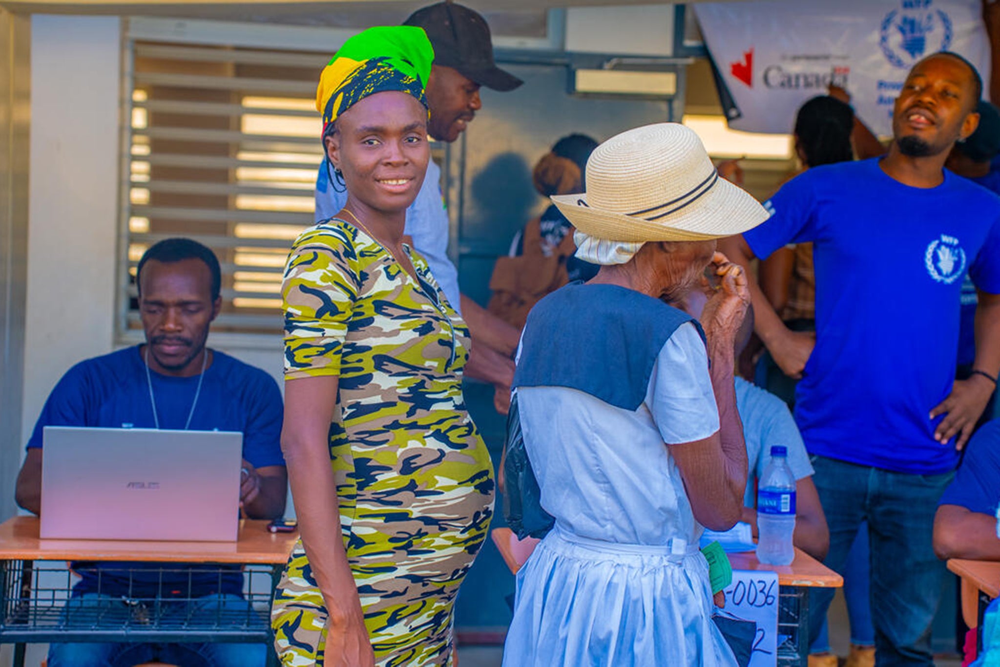 People queue for food in the conflict-ridden Bas Artibonite region