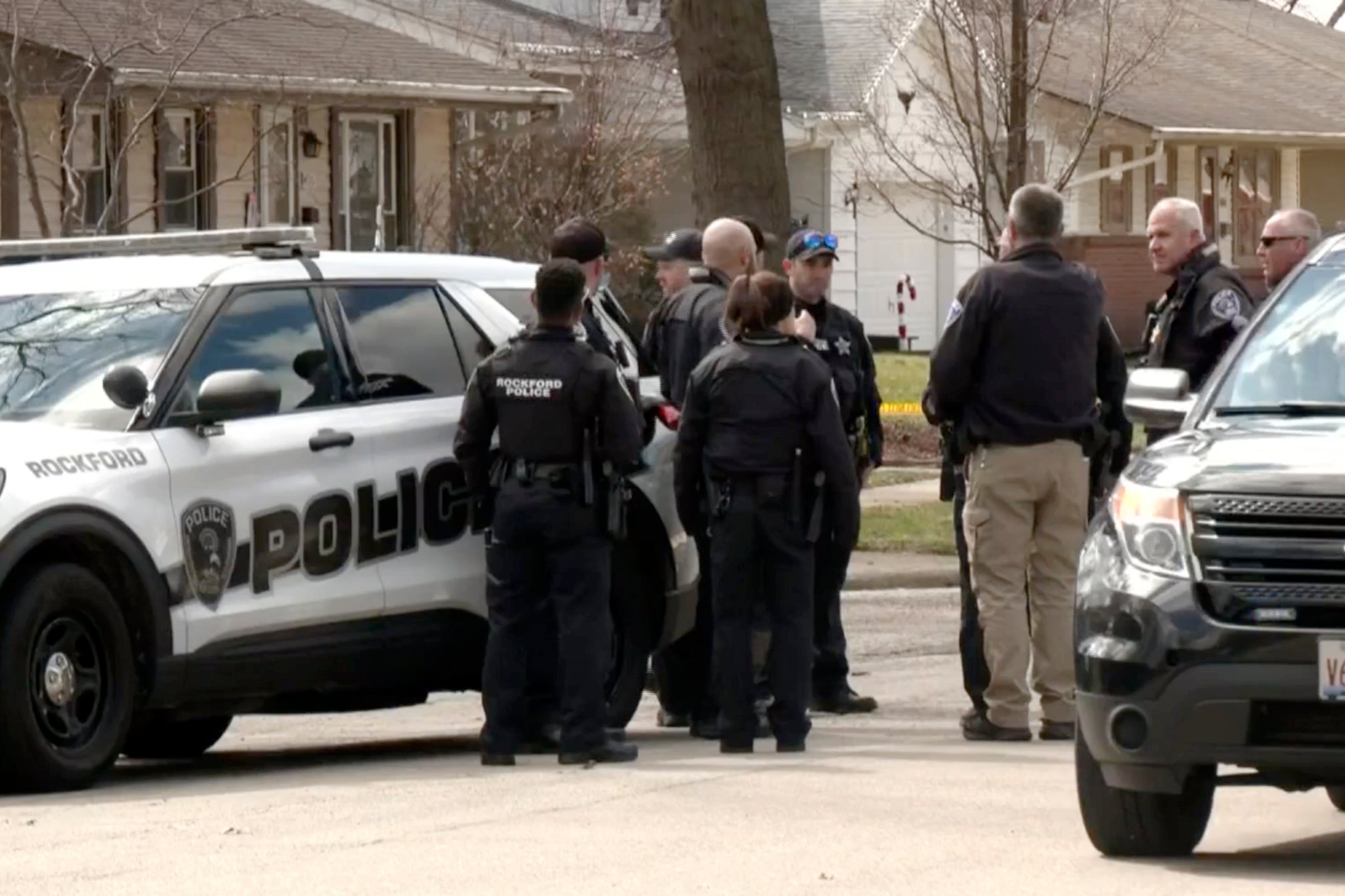 Law enforcement personnel work at the scene of one of the attacks