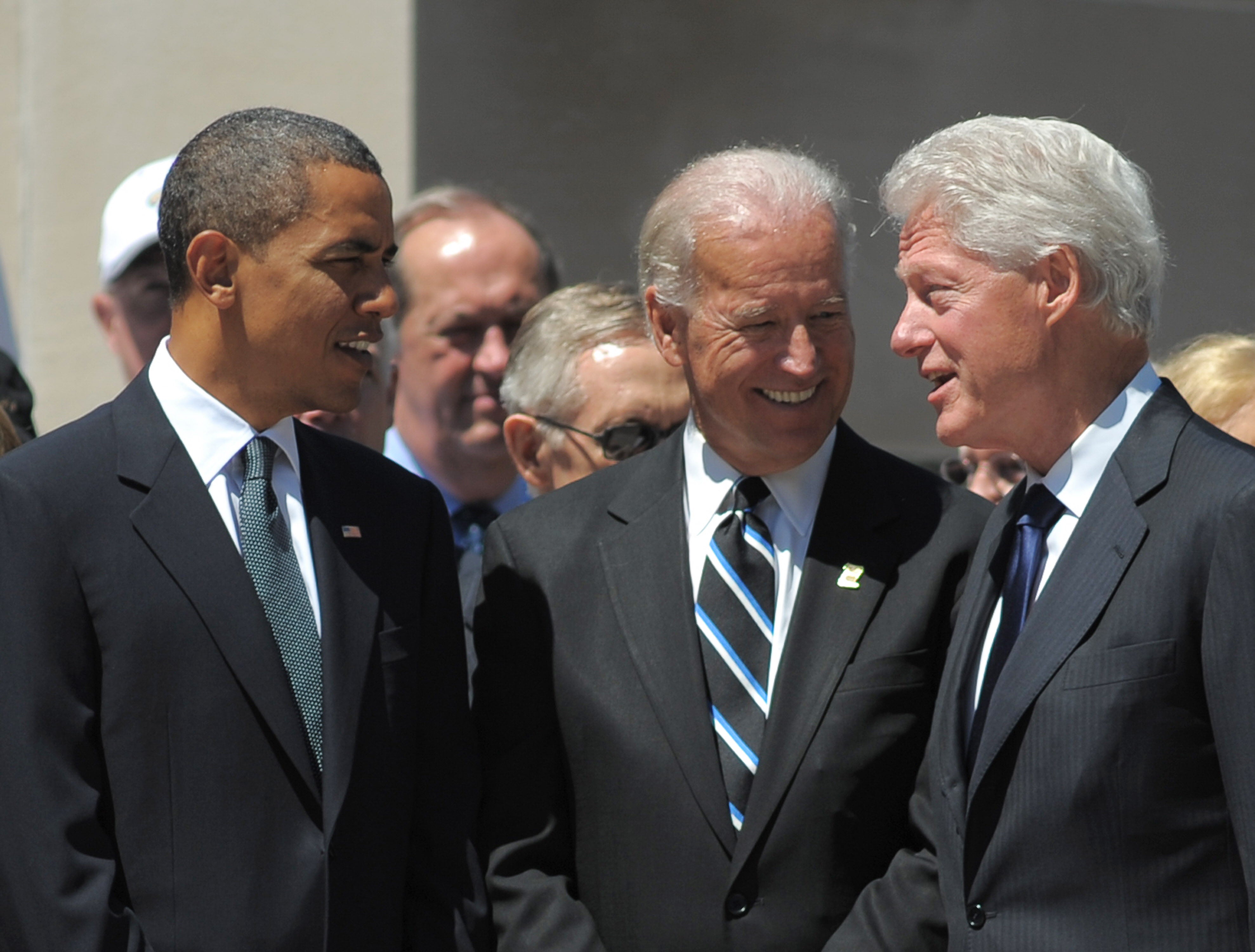 US president Barack Obama (L), vice-president Joe Biden (C) and former president Bill Clinton chat before the start of a memorial service for US Senator Robert Byrd on 2 July 2010 at the West Virginia State Capitol in Charleston, West Virginia