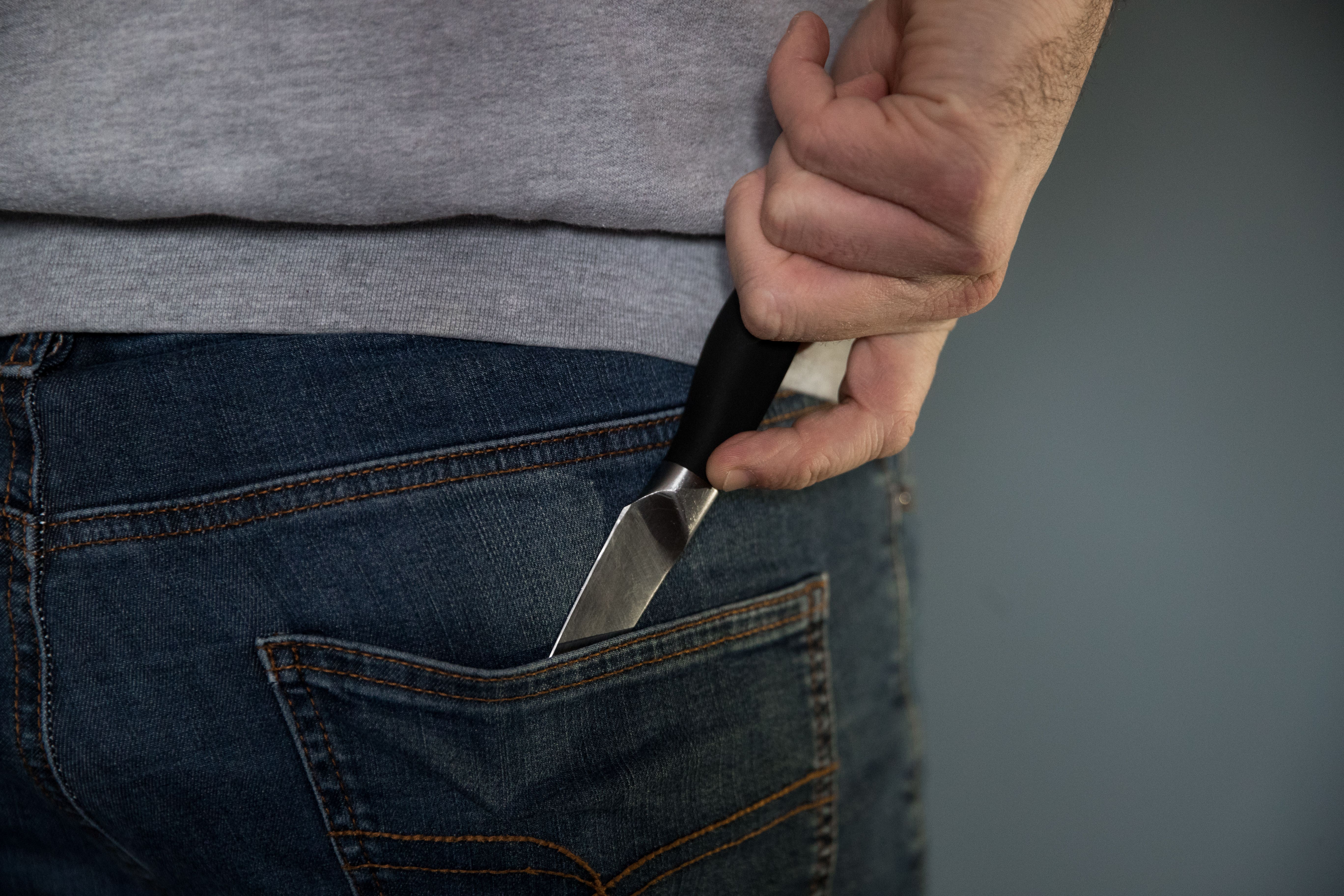 A model poses holding a knife (PA)