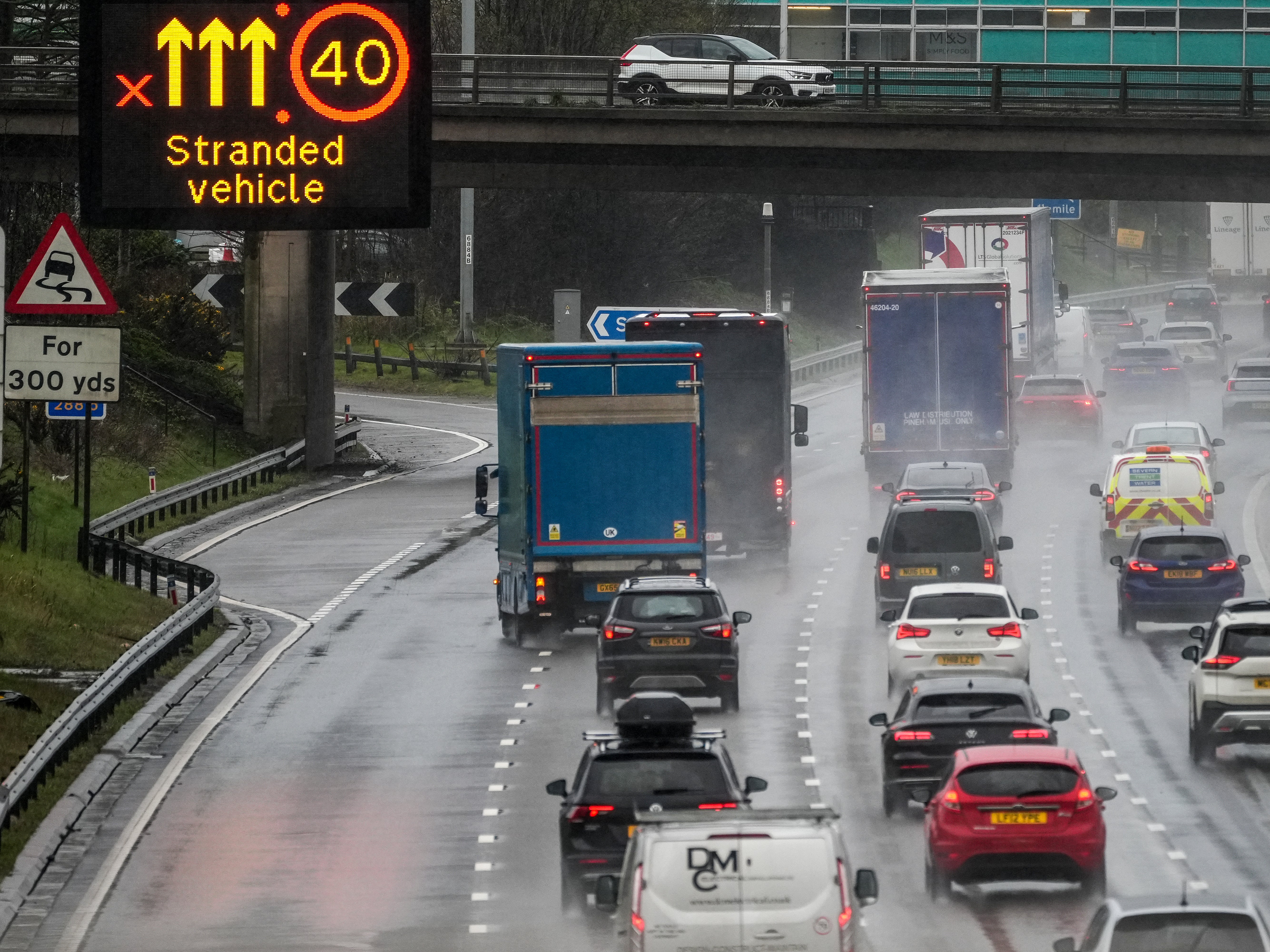 Afternoon rush hour and bank holiday traffic begins to build up on M6 motorway