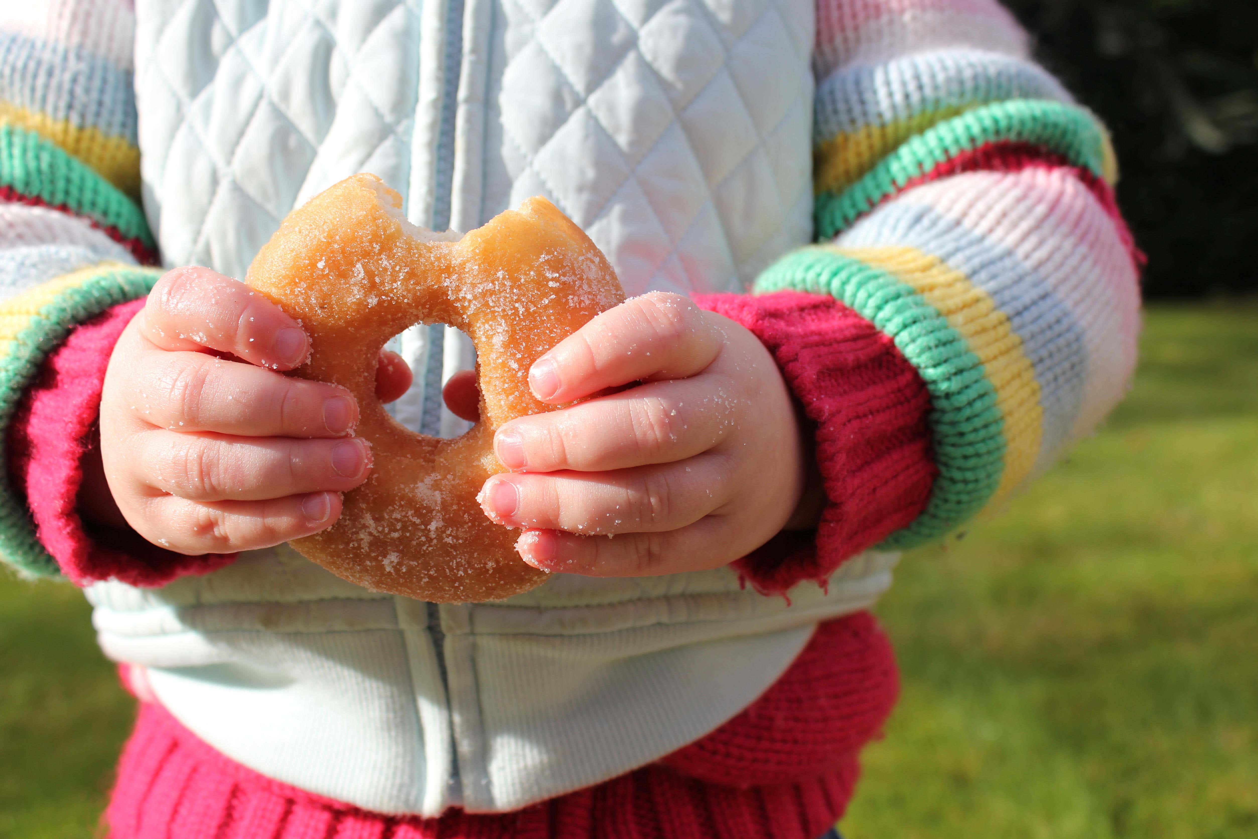 A child holding a donut