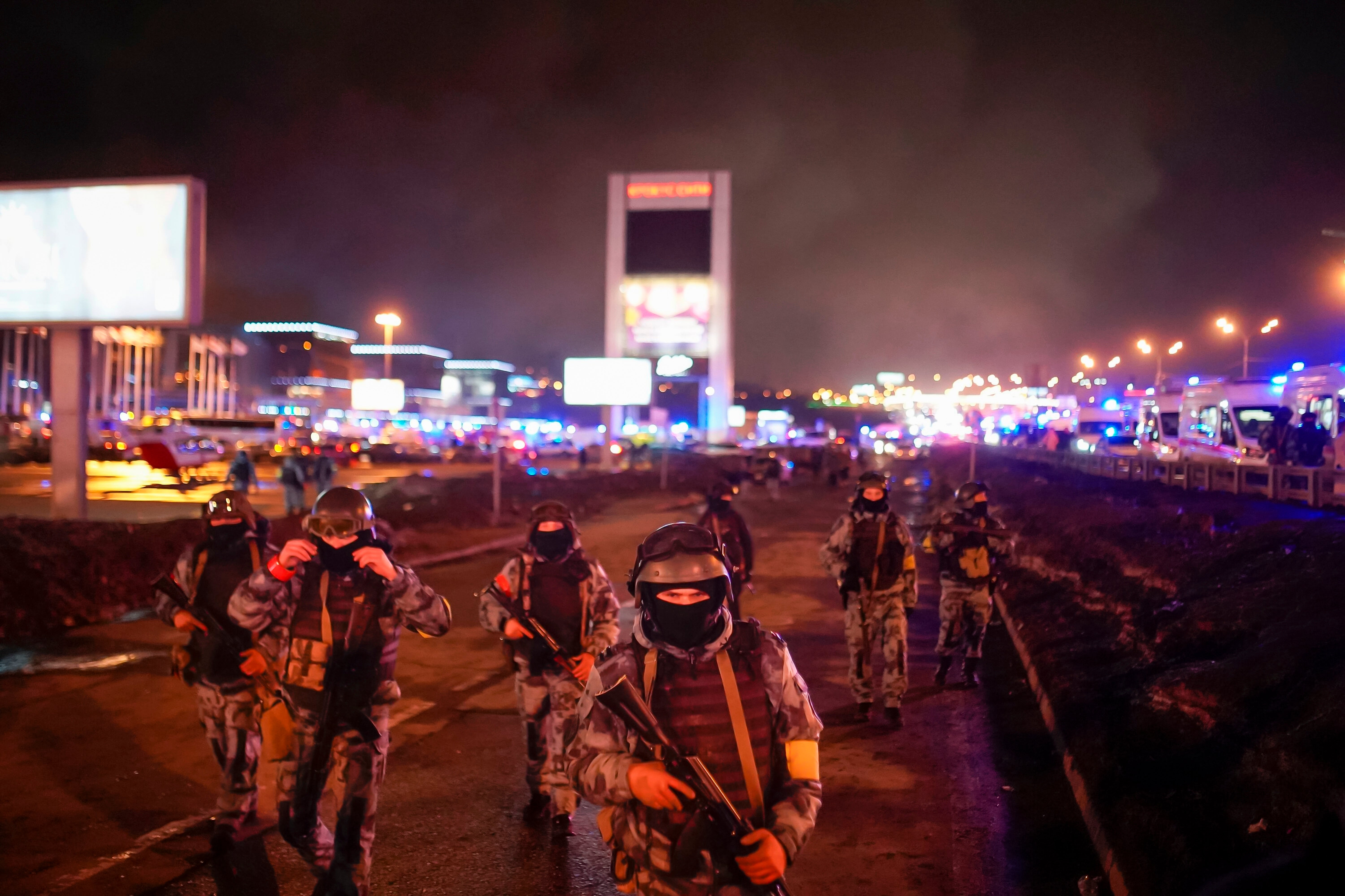 Russian soldiers secure an area at near the Crocus City Hall concert venue on the western edge of Moscow, Russia, on Saturday, March 23, 2024