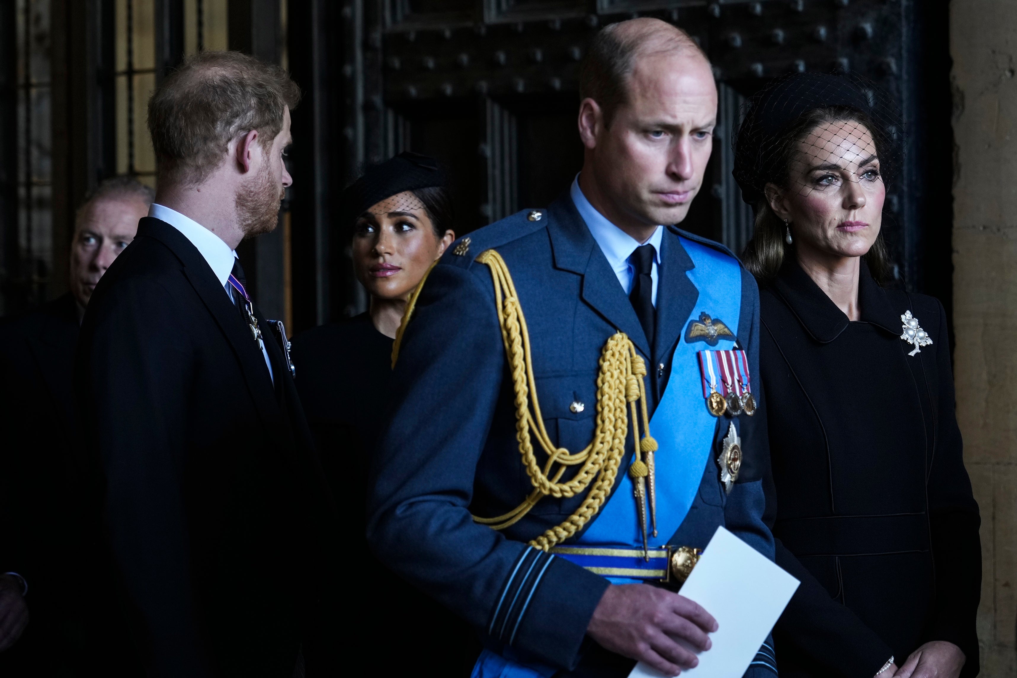 Britain's Prince William, second right, Kate, Princess of Wales, right, Prince Harry, left, and Meghan, Duchess of Sussex, second left, leave after they paid their respects to Queen Elizabeth II in Westminster Hall for the Lying-in State, in London, Wednesday, 14 Sept 2022