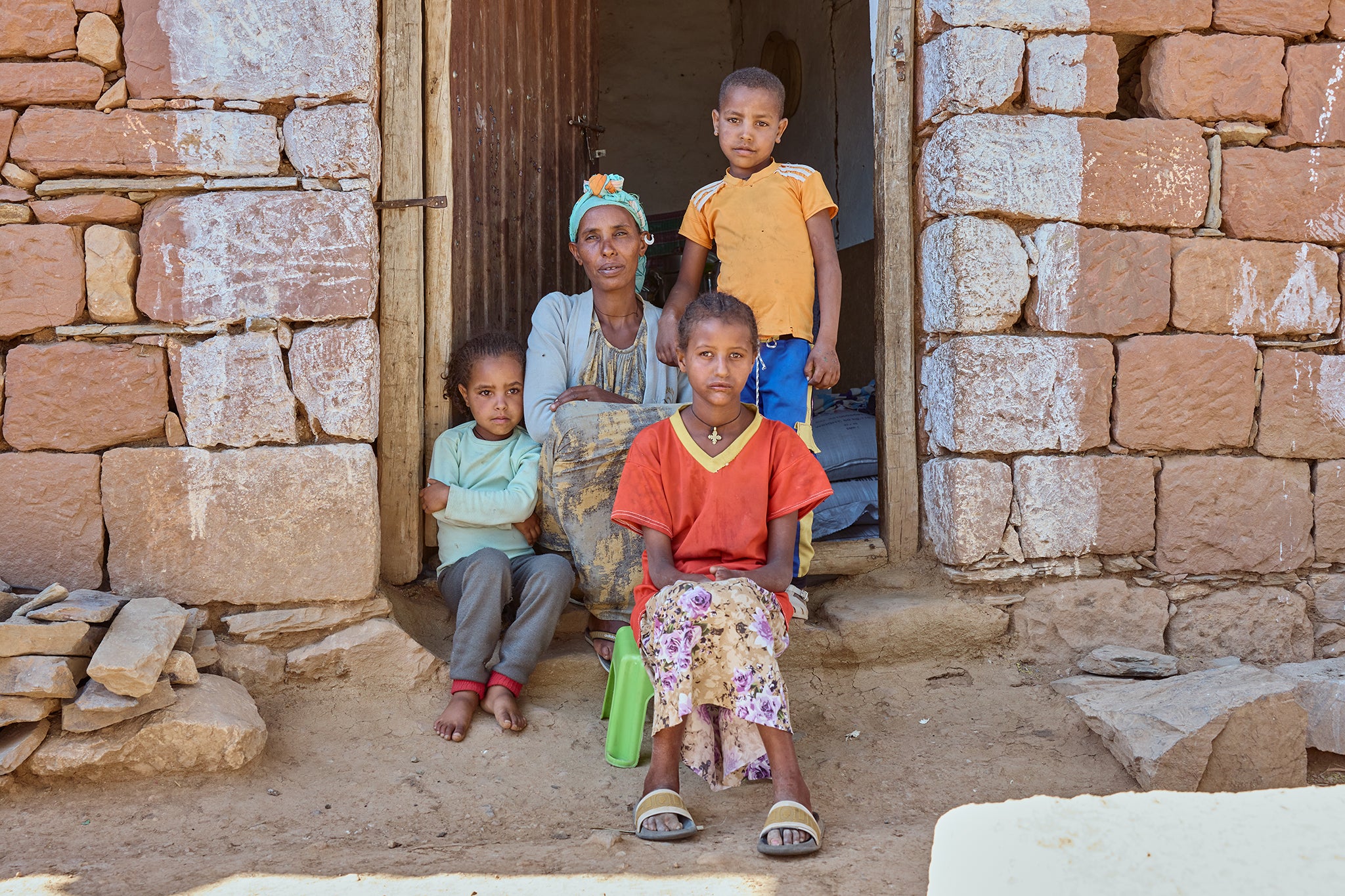 Rahwa (front), a pupil at Megab Primary School, with her mother and siblings