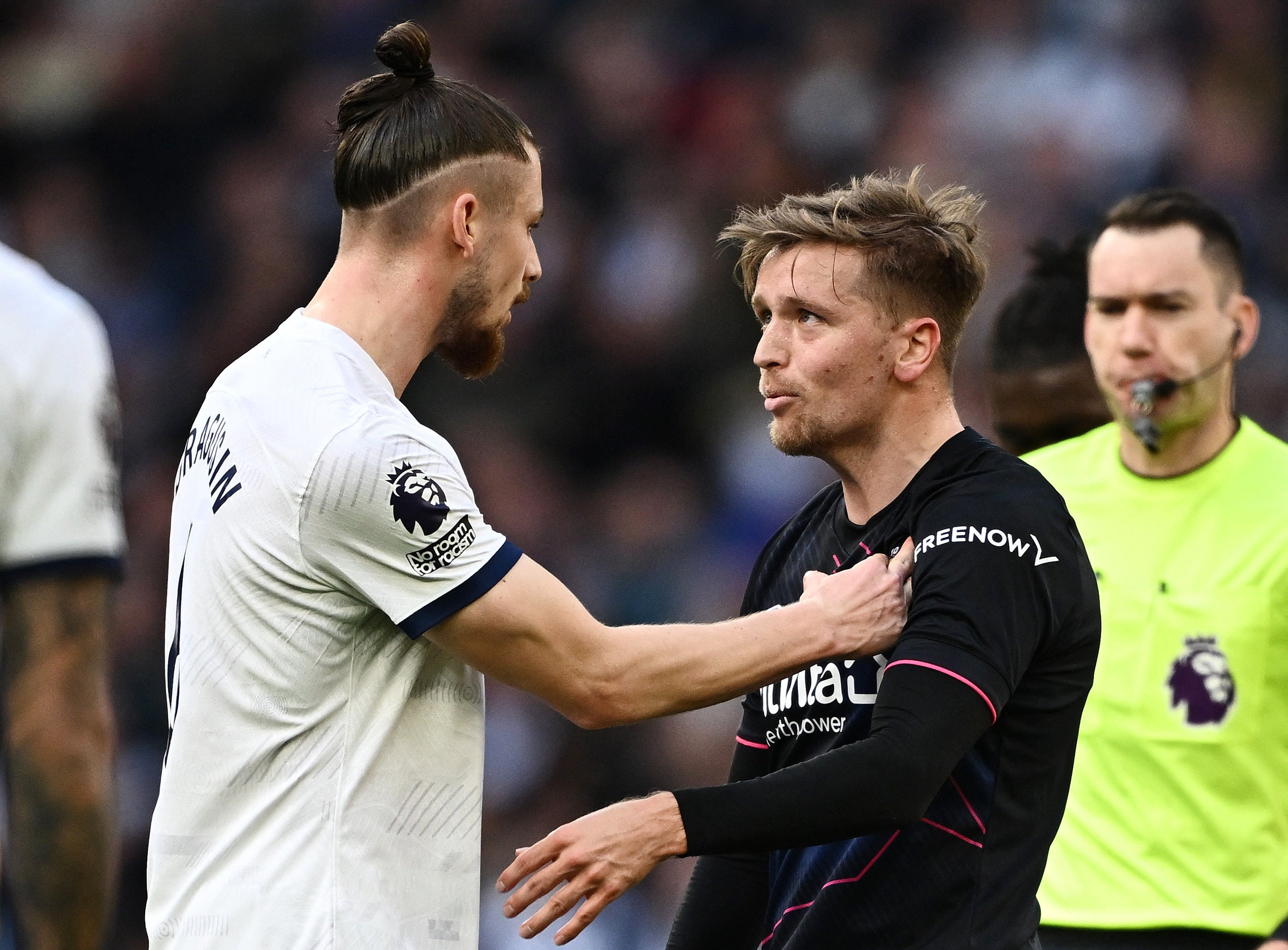 Tottenham’s Radu Dragusin and Luton’s Luke Berry clash