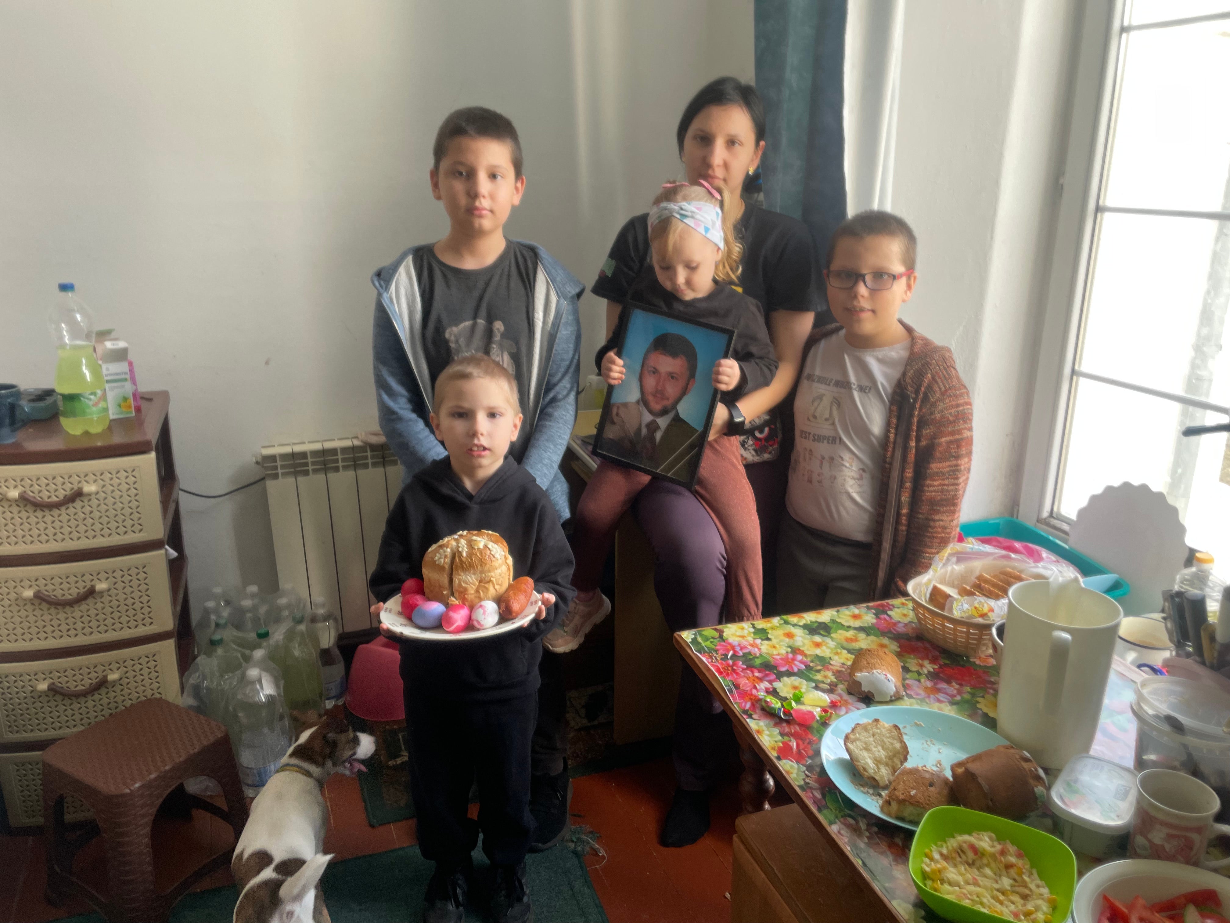 Kateryna with her four children and their dog, Badyk