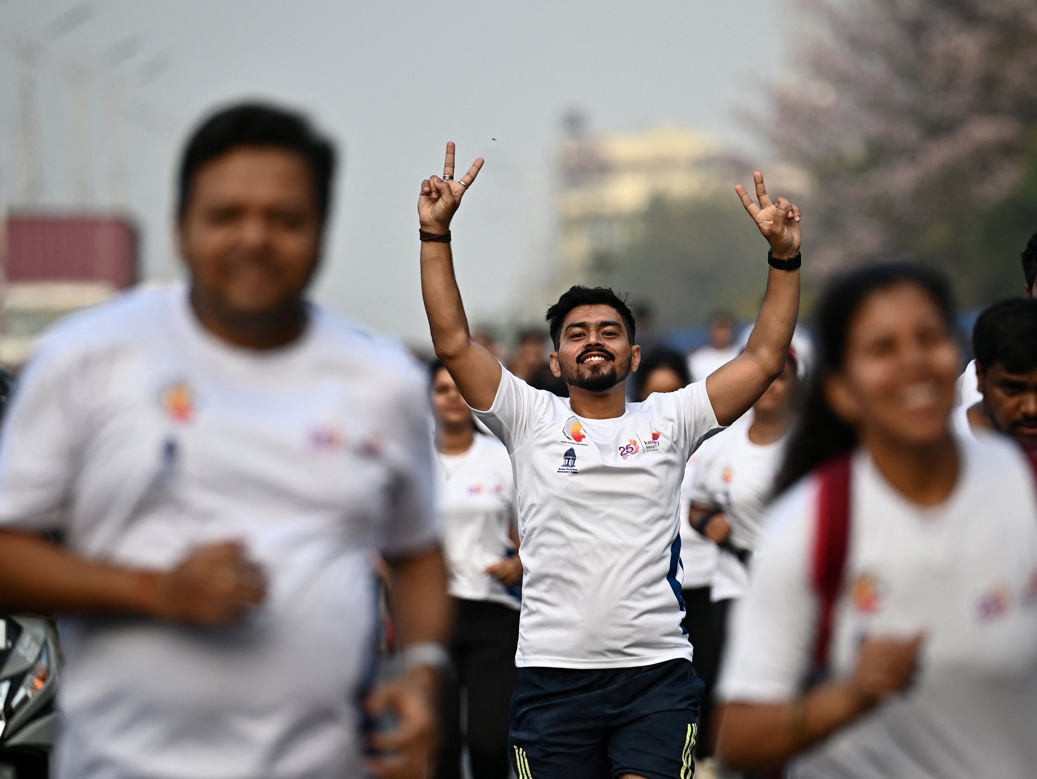 Participants walk down a road during a ‘Vote-A-Thon’ to encourage turnout