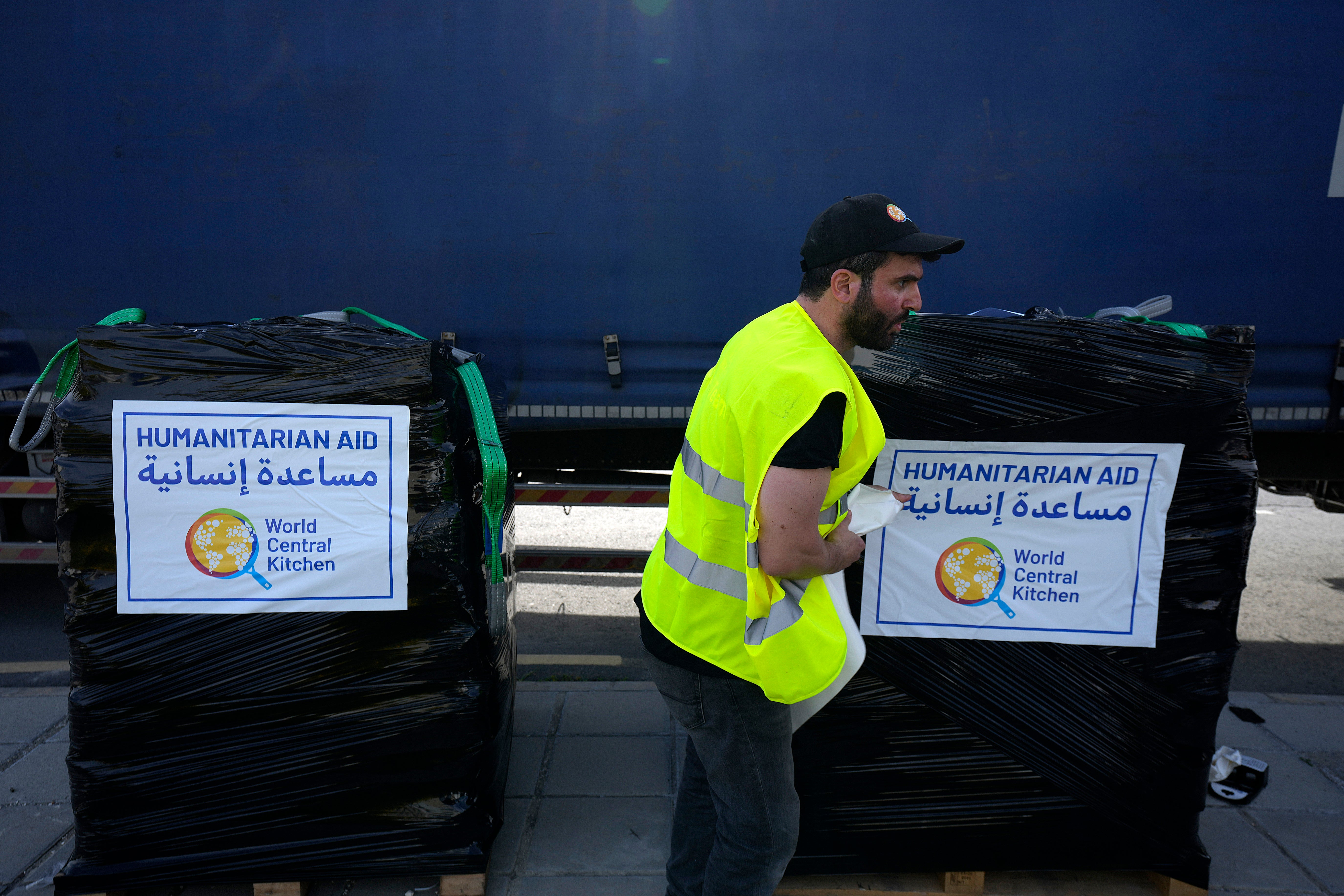 An aid worker pictured on 13 March 2024 loads aid for transport to Gaza. World Central Kitchen provided thousands of meals per day to Palestinians.