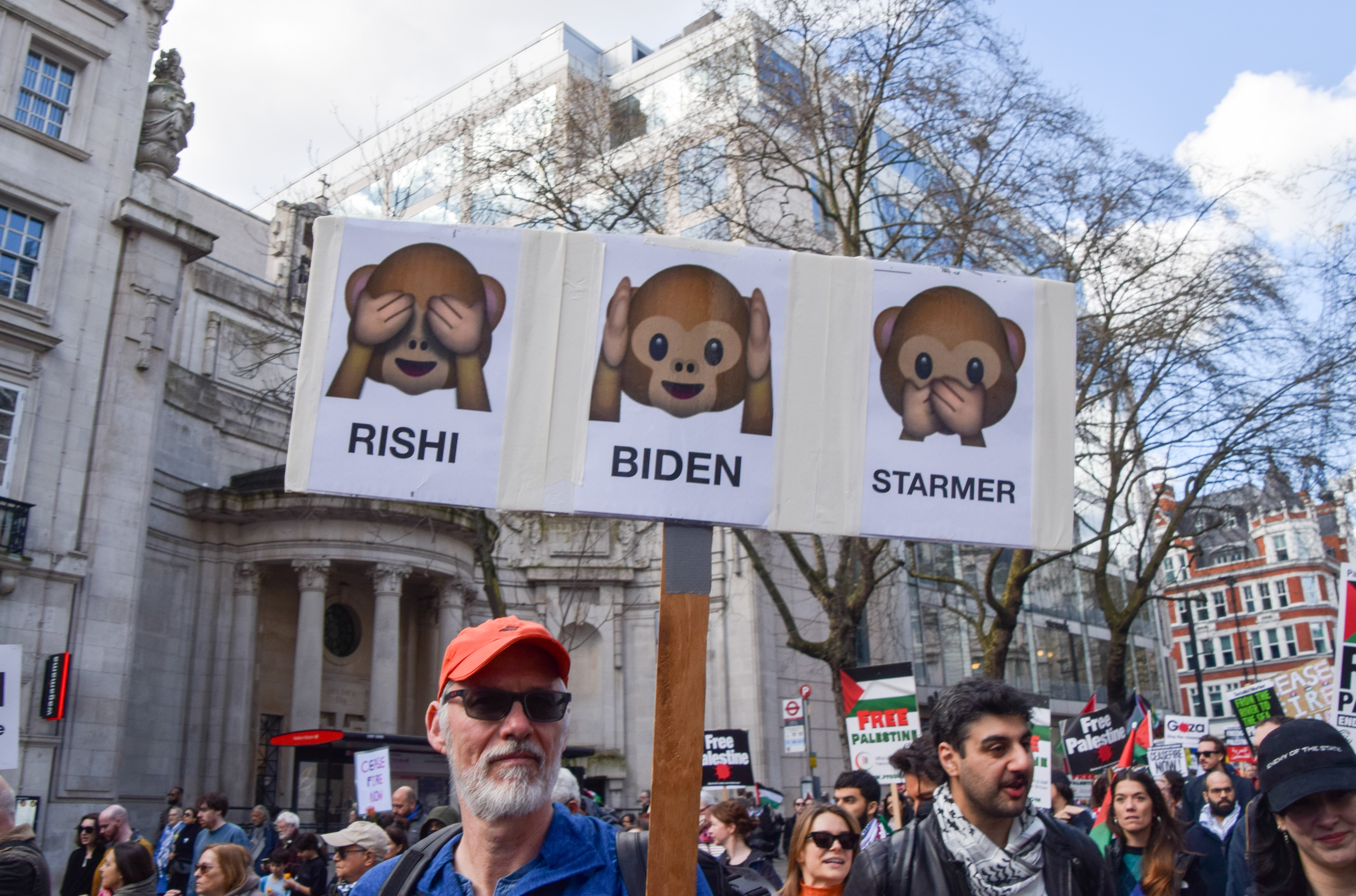 A protest sign in central London on Saturday is emblematic of the pressure on US president Joe Biden and British prime minister Rishi Sunak