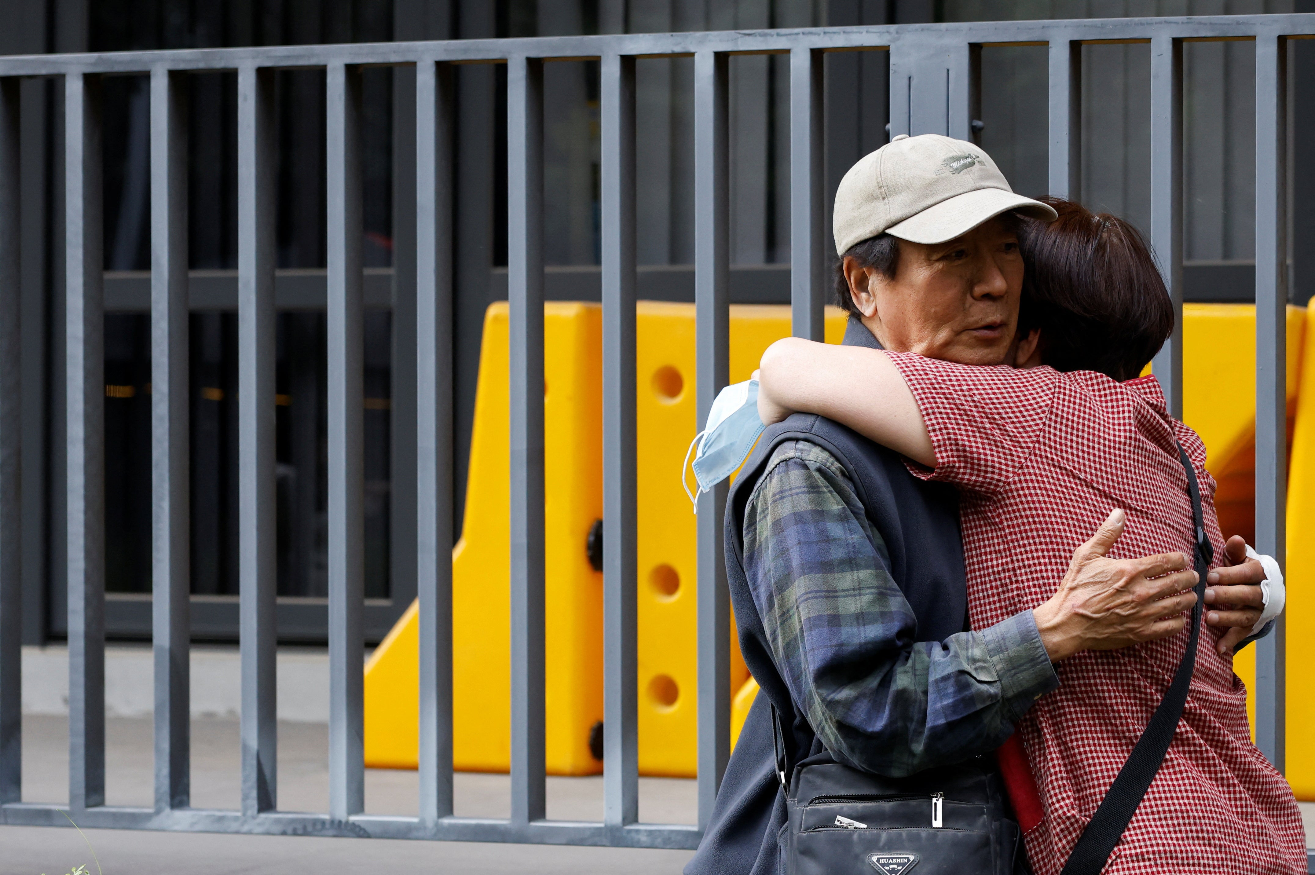 A relative hugs a man who was rescued from a remote area, following the earthquake, in Hualien, Taiwan