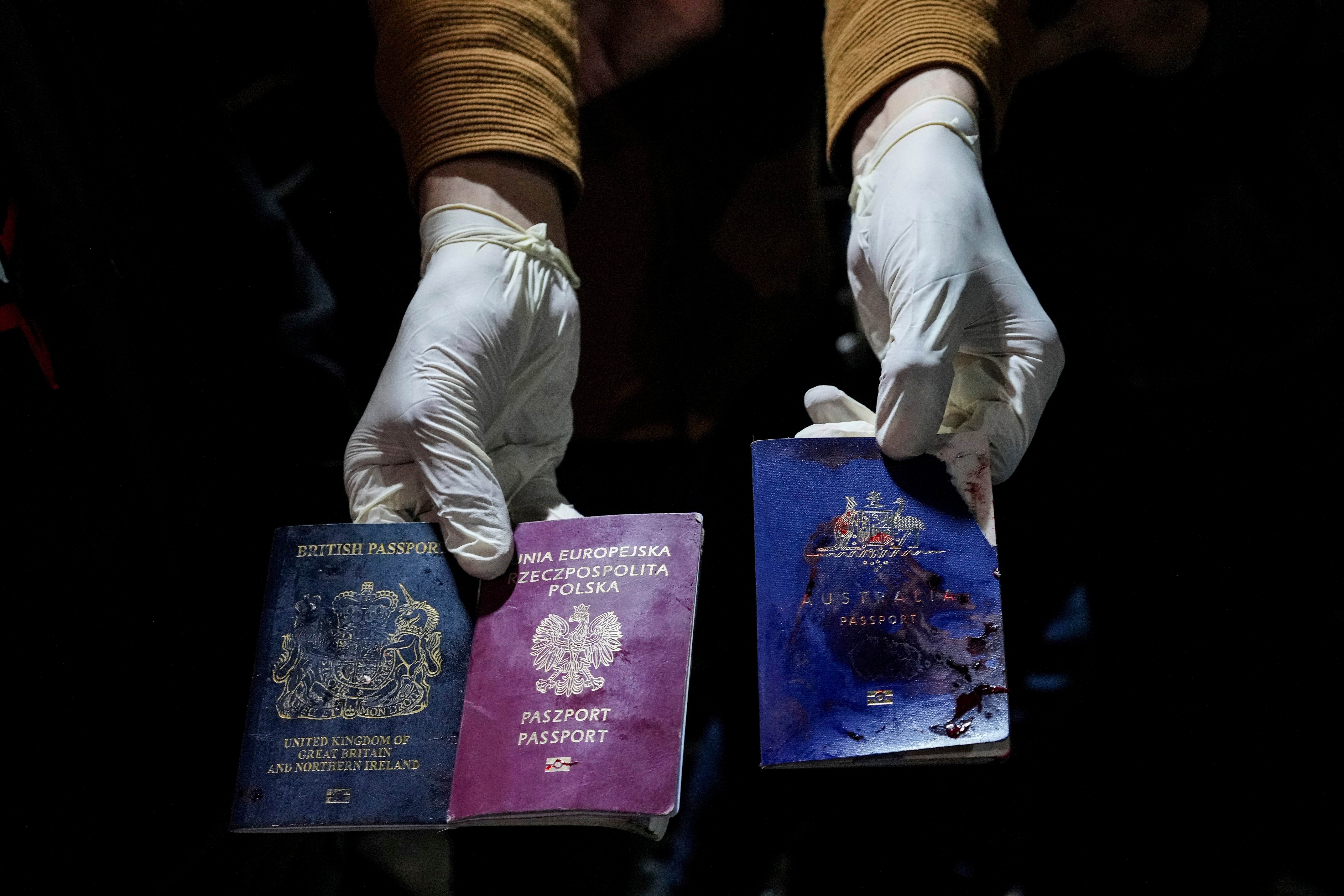 Blood-stained British, Polish, and Australian passports after an Israeli airstrike killed seven aid workers in Gaza