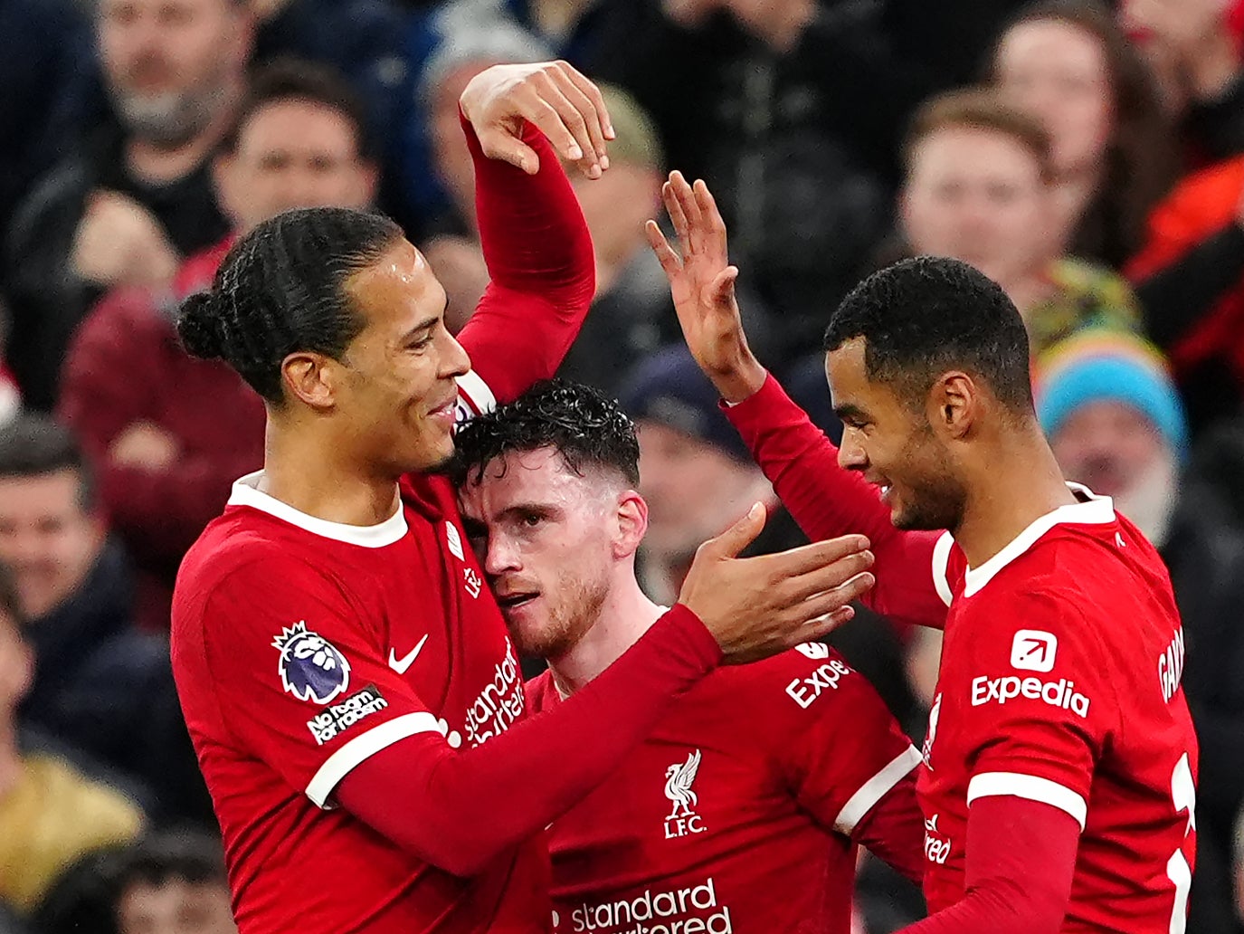 Virgil van Dijk, Andy Robertson and Cody Gakpo celebrate Liverpool’s third goal