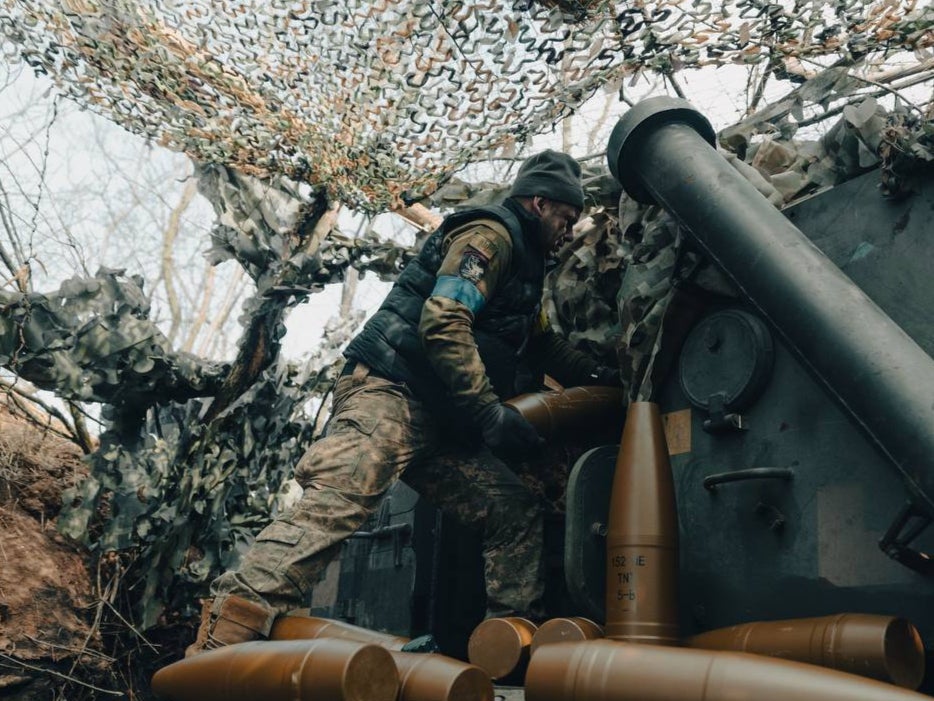 A Ukrainian soldier of the 3rd Assault Brigade fires at Russian positions in the Avdiivka direction