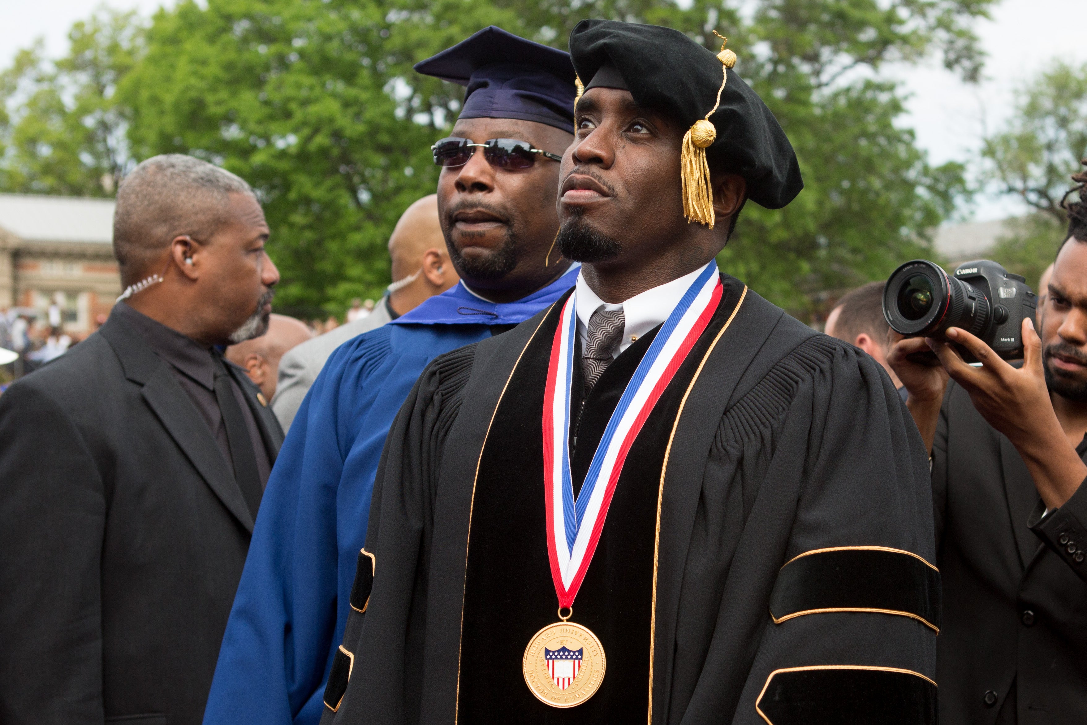 Entrepreneur and philanthropist Sean "Diddy" Combs arrives at Howard University's 146th commencement exercises on May 10, 2014 in Washington, D.C; the university stripped him of his honorary degree and disbanded a scholarship his name following violent allegations and the release of a video showing him beating a woman