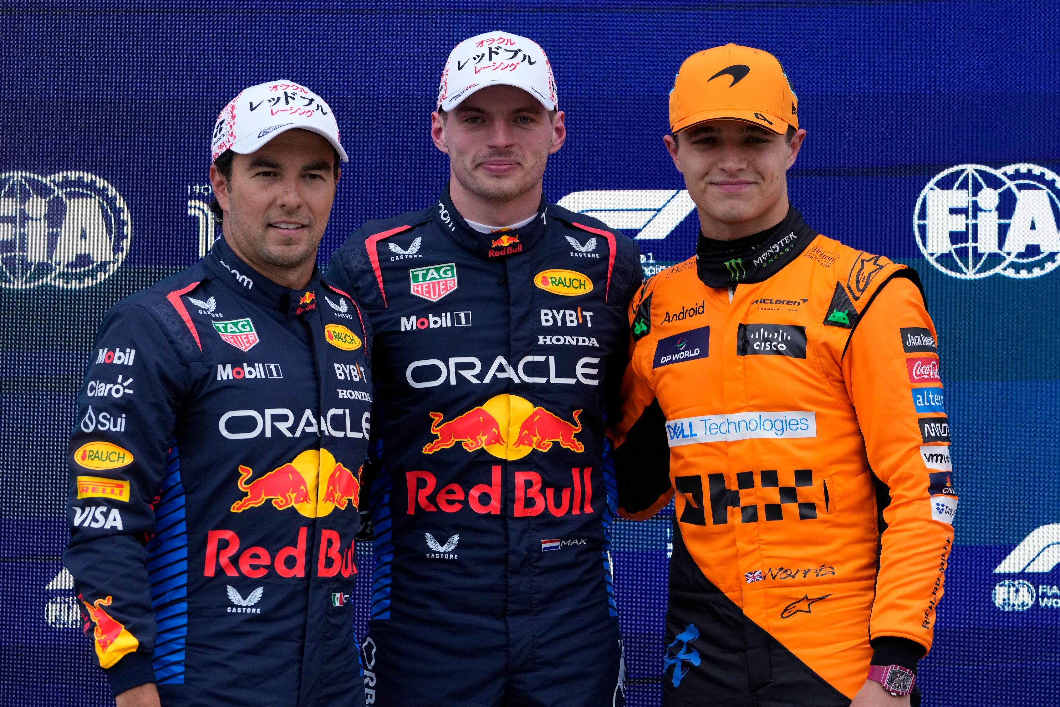 Lando Norris will be trying to beat Red Bull pair Sergio Perez (left) and Max Verstappen (centre) off the line in Japan. (Hiro Komae/AP)