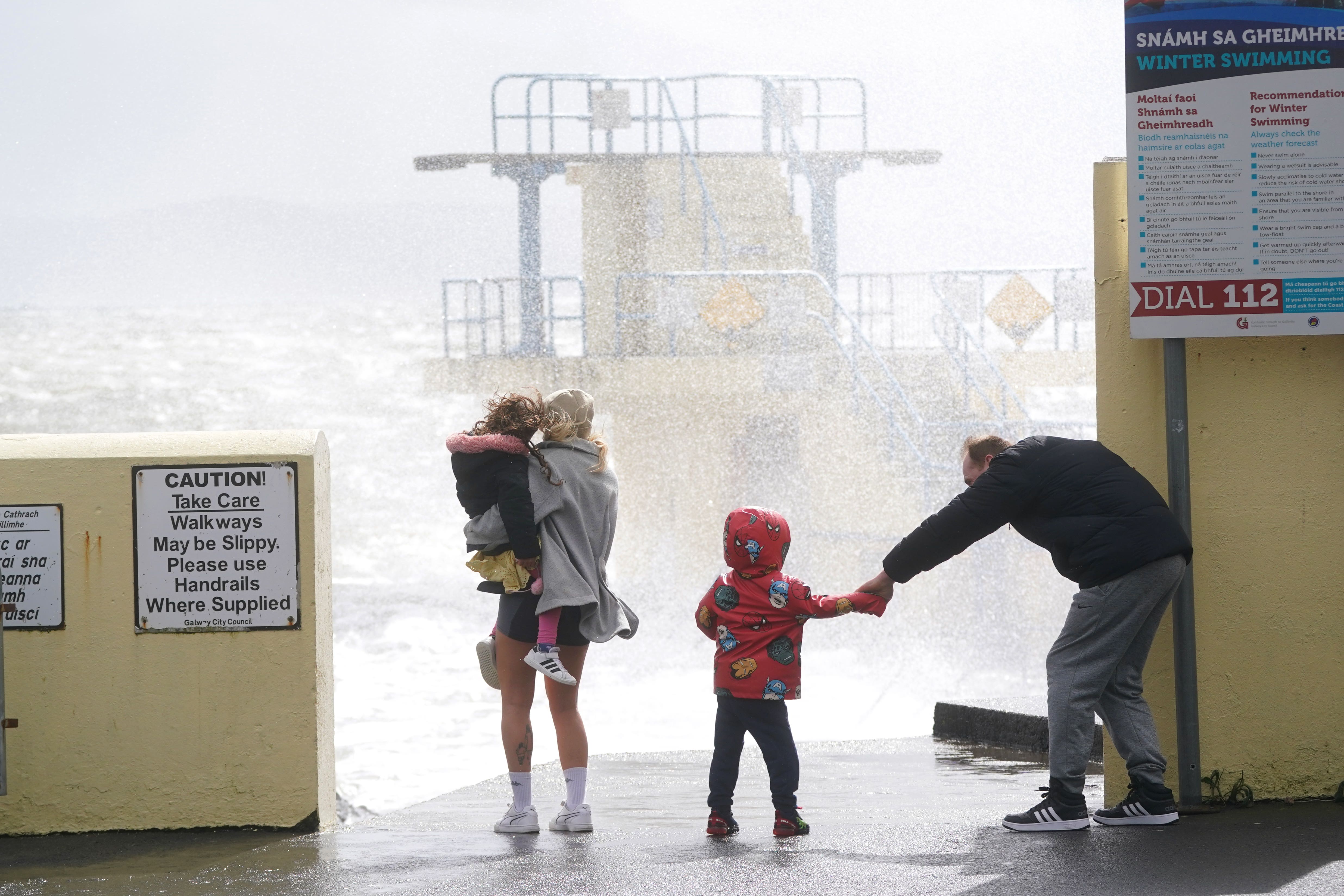 People look at the waves at Blackrock Diving Board, Salthill, Co Galway (Brian Lawless/PA)