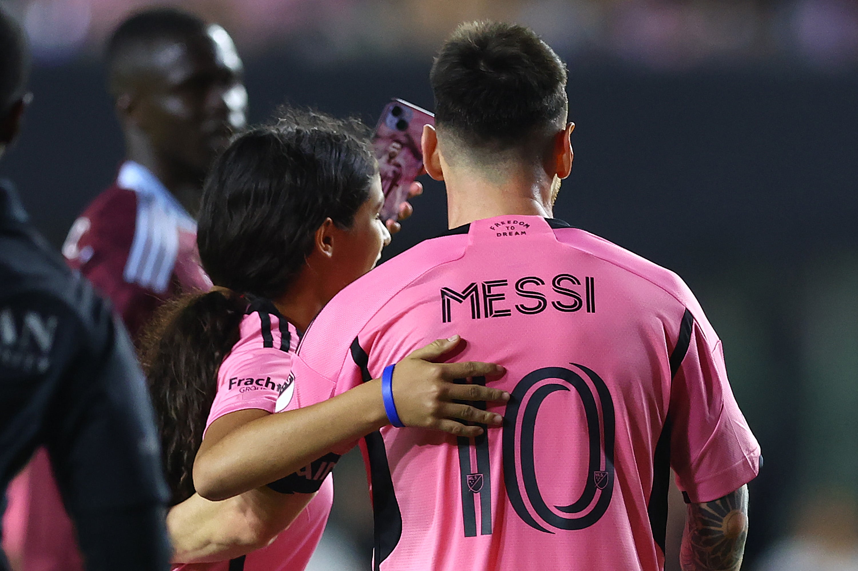 Fans rushed onto the field to take a selfie with Messi