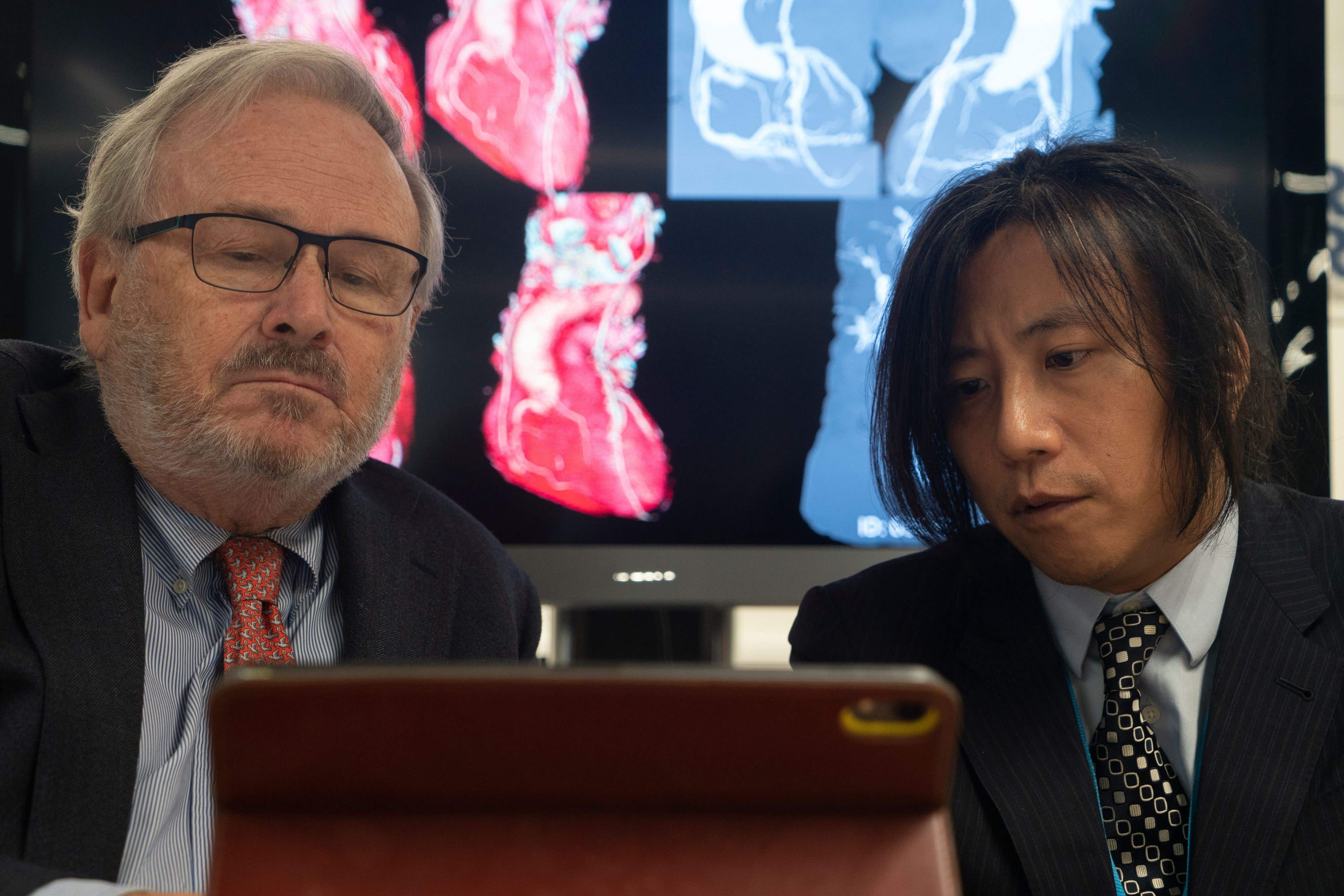 Prof Patrick W Serruys and Prof Yoshi Onuma in the CORRIB Core Lab at University of Galway (University of Galway/PA)